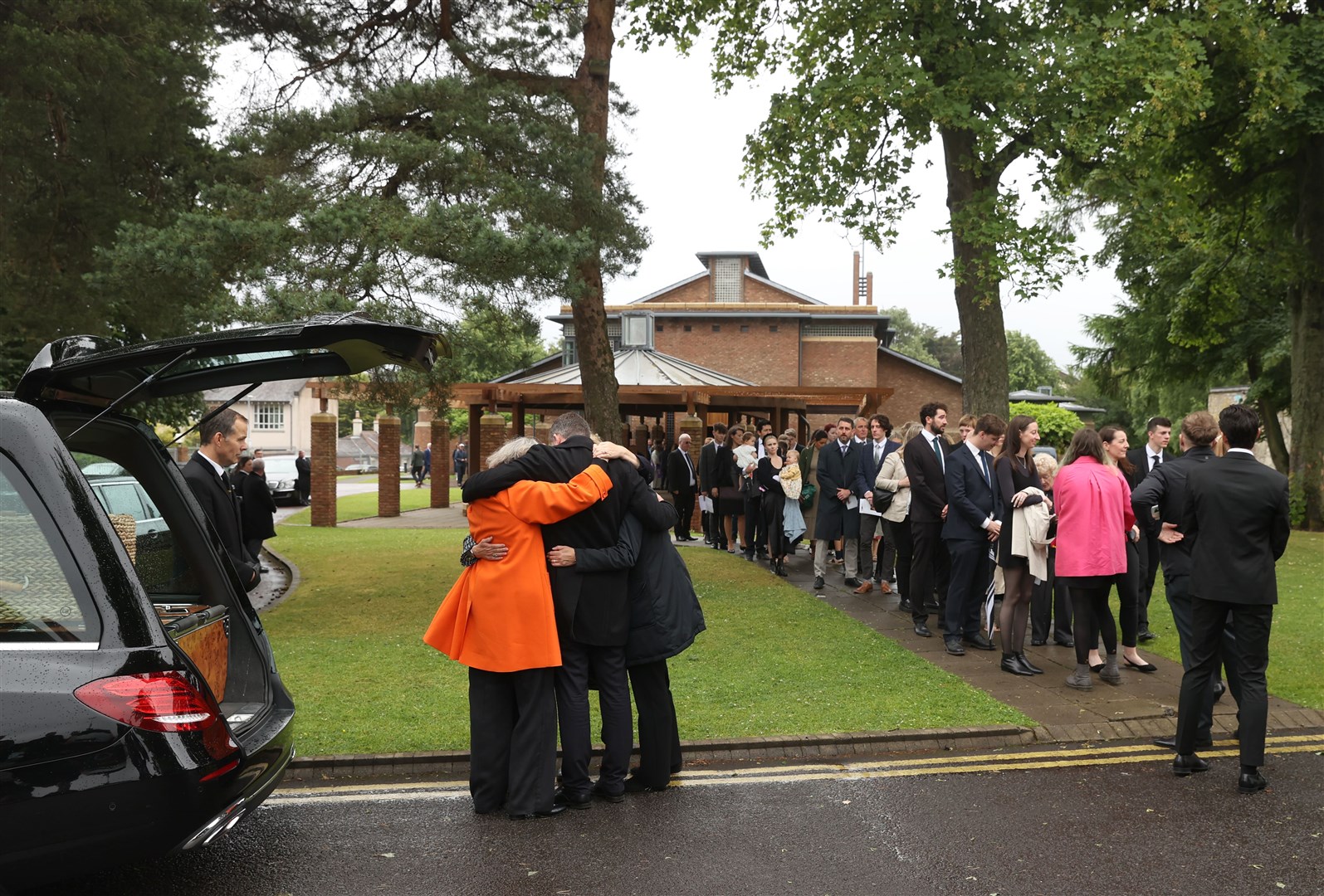 Mourners leaving the funeral of Jim Fitzpatrick (Liam McBurney/PA)