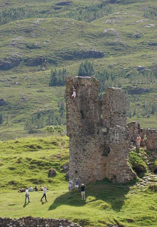 People flouting the rules climbing on the walls of ancient ruin Ardvreck Castle, which has also been subject to 'dirty' campers.