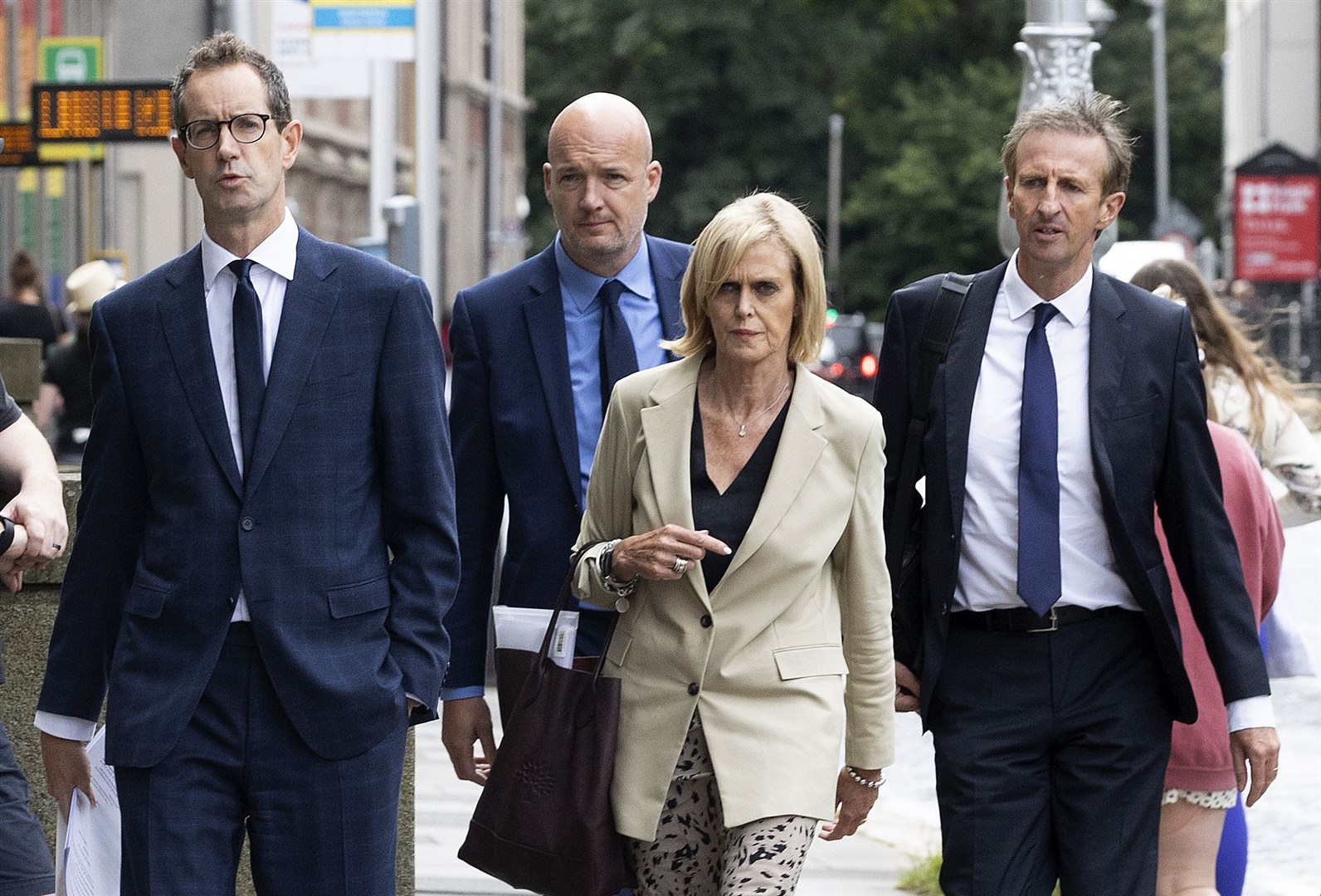 RTE interim deputy director general Adrian Lynch (left), commercial director Geraldine O’Leary (second right), chief financial officer Richard Collins (right) and strategy director Rory Coveney arriving at Leinster House (Brian Lawless/PA)