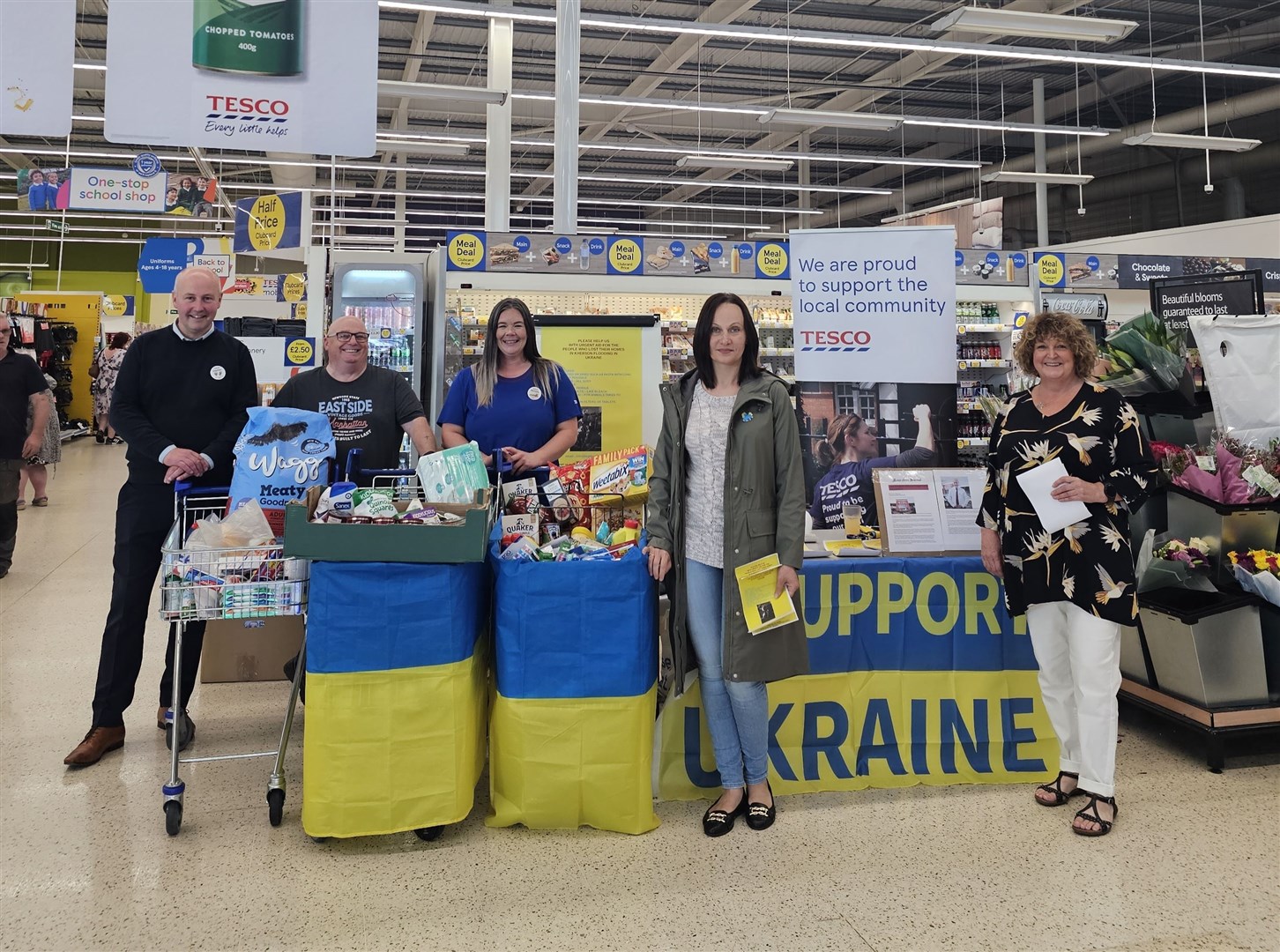 Impressed by the generosity of Dingwall shoppers are Tesco superstore manager Stephen McEwan (left) and customer champion Michelle MacKay (centre) with Billy Jackson, Maryna Kudriavtseva and Elisabeth Jackson of local charity Highlands for Ukraine.