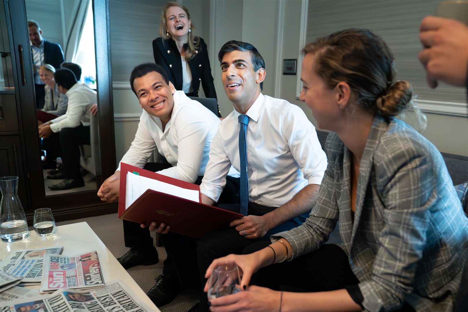 Prime Minister Rishi Sunak holds a meeting with his staff in his hotel room ahead of his keynote speech to the Conservative Party annual conference (Stefan Rousseau/PA)