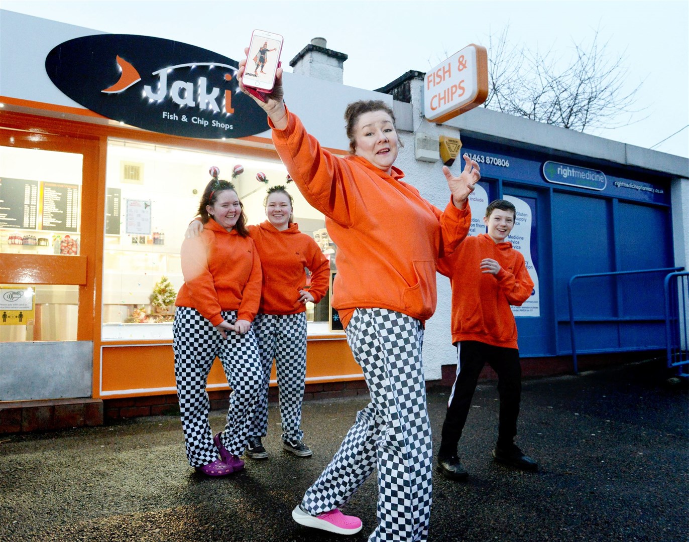 Jaki's Fish & Chip Shop in Muir of Ord has unveiled a new superhero – Batterman. Counter assistant Kirstie Clark, supervisor Connie Urquhart, business owner Jaki Pickett and tattie king Scott Fraser are ready for action. Picture: James Mackenzie