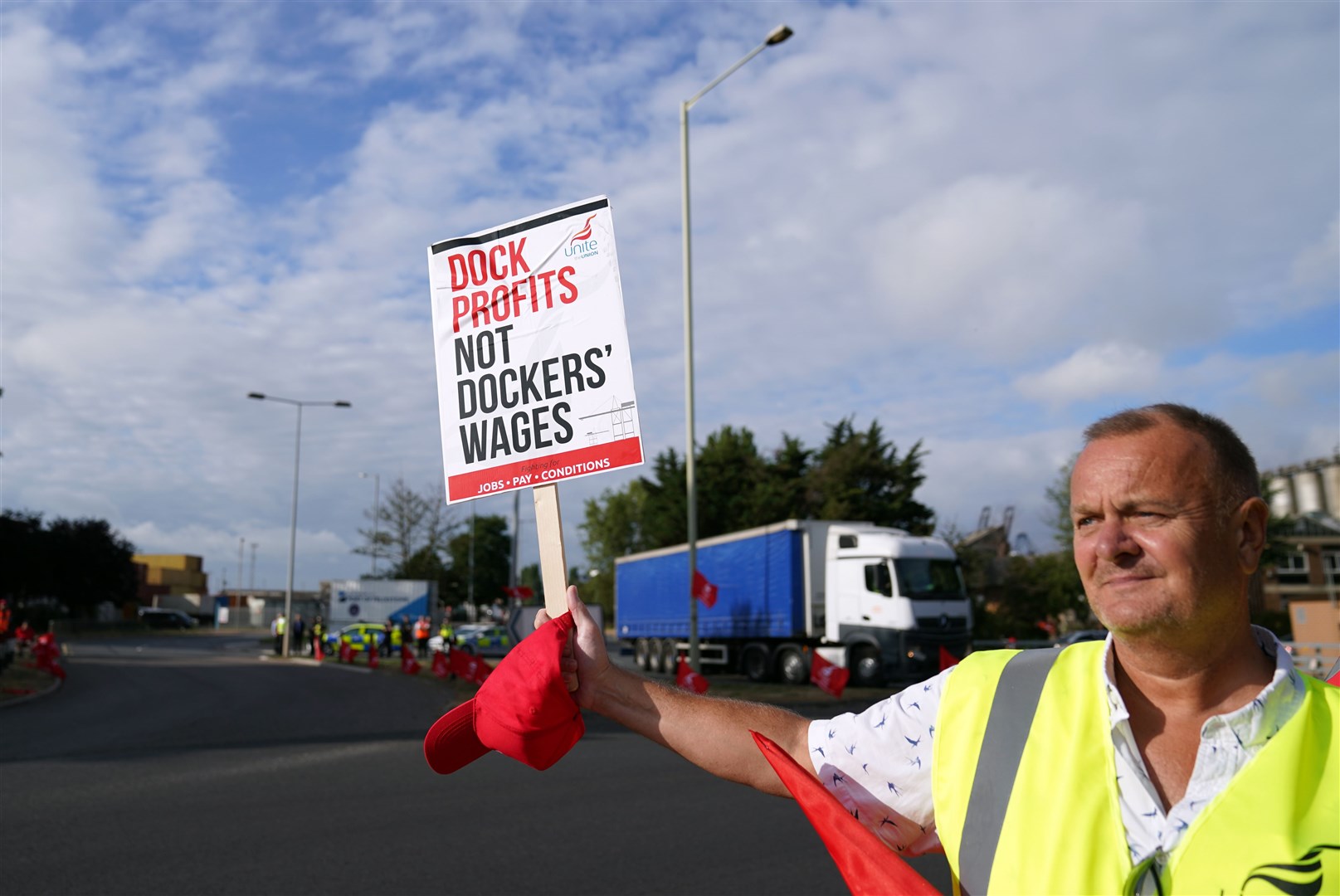 Members of the Unite union on a picket line at one of the entrances to the Port of Felixstowe in Suffolk (Joe Giddens/ PA)