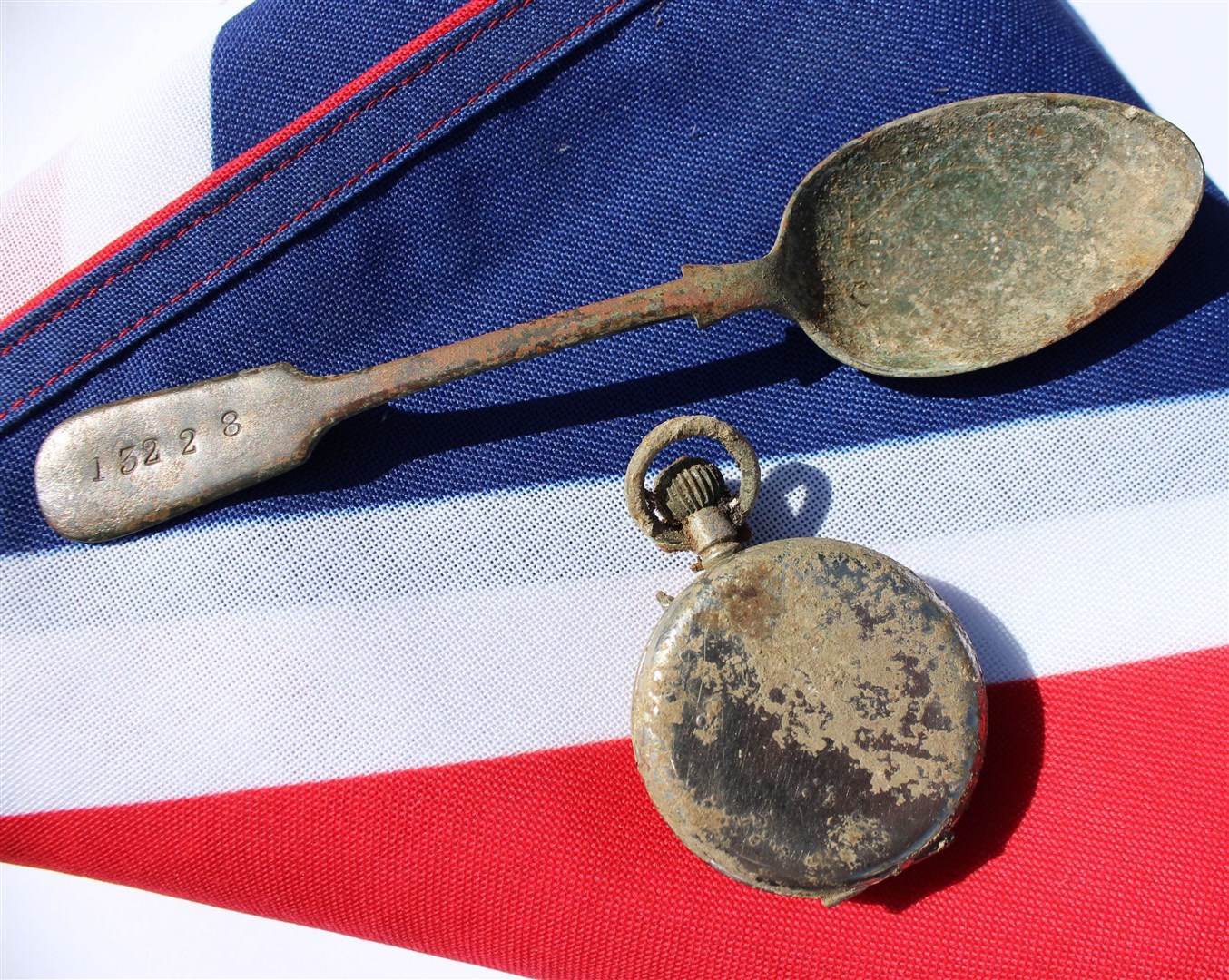 A spoon and a pocket watch which belonged to Private William Johnston and were found alongside his remains (MoD/A Eden/Crown Copyright/PA)