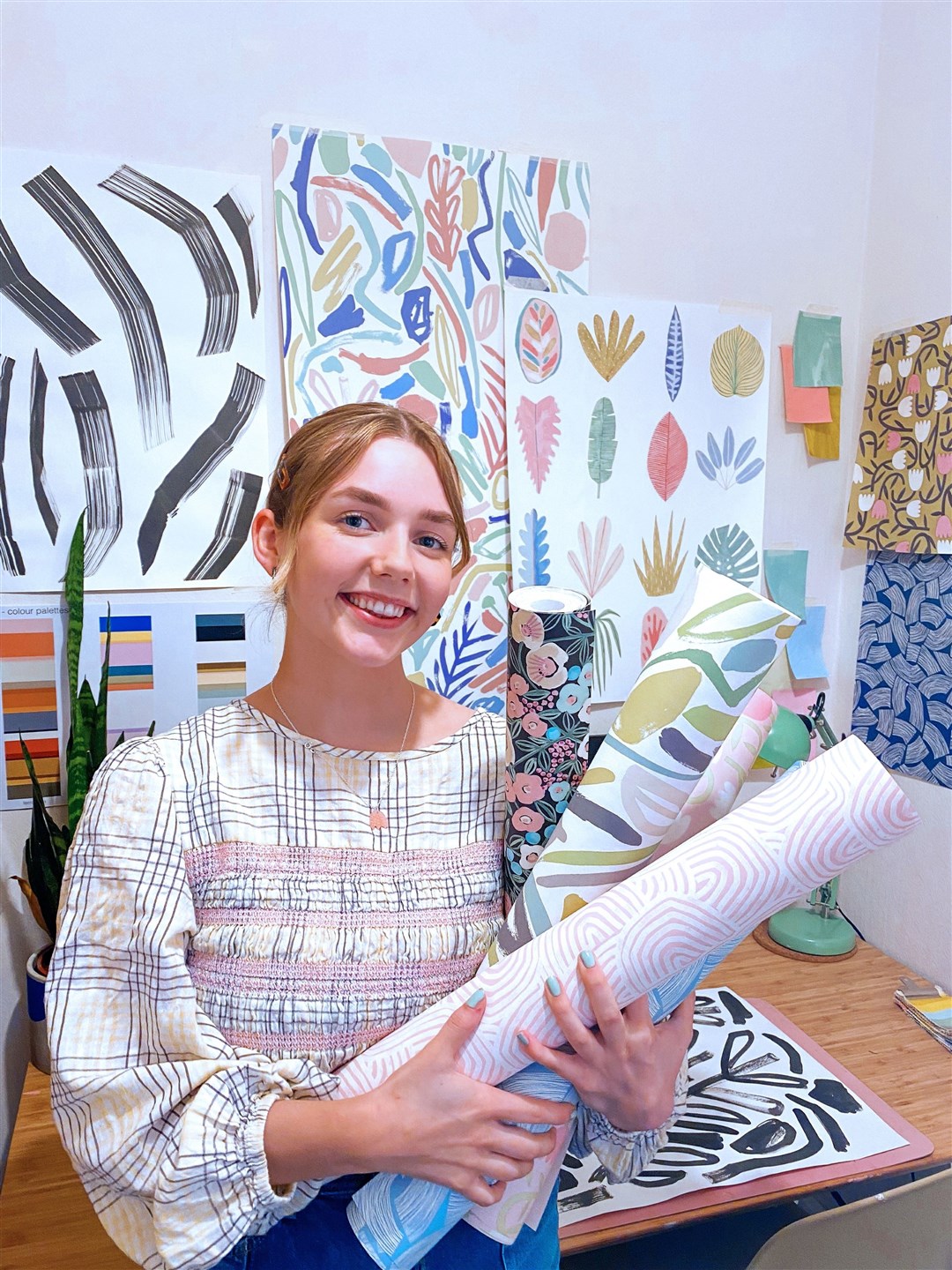 Rosanna Dyke with wallpaper in a studio.