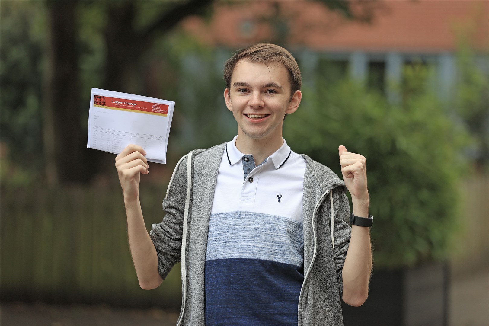 STUDENT DETAILS PIXELATED BY PA PICTURE DESK Head boy Chris Cassells at Lagan College, Belfast, receives his A-level results (Liam McBurney/PA)