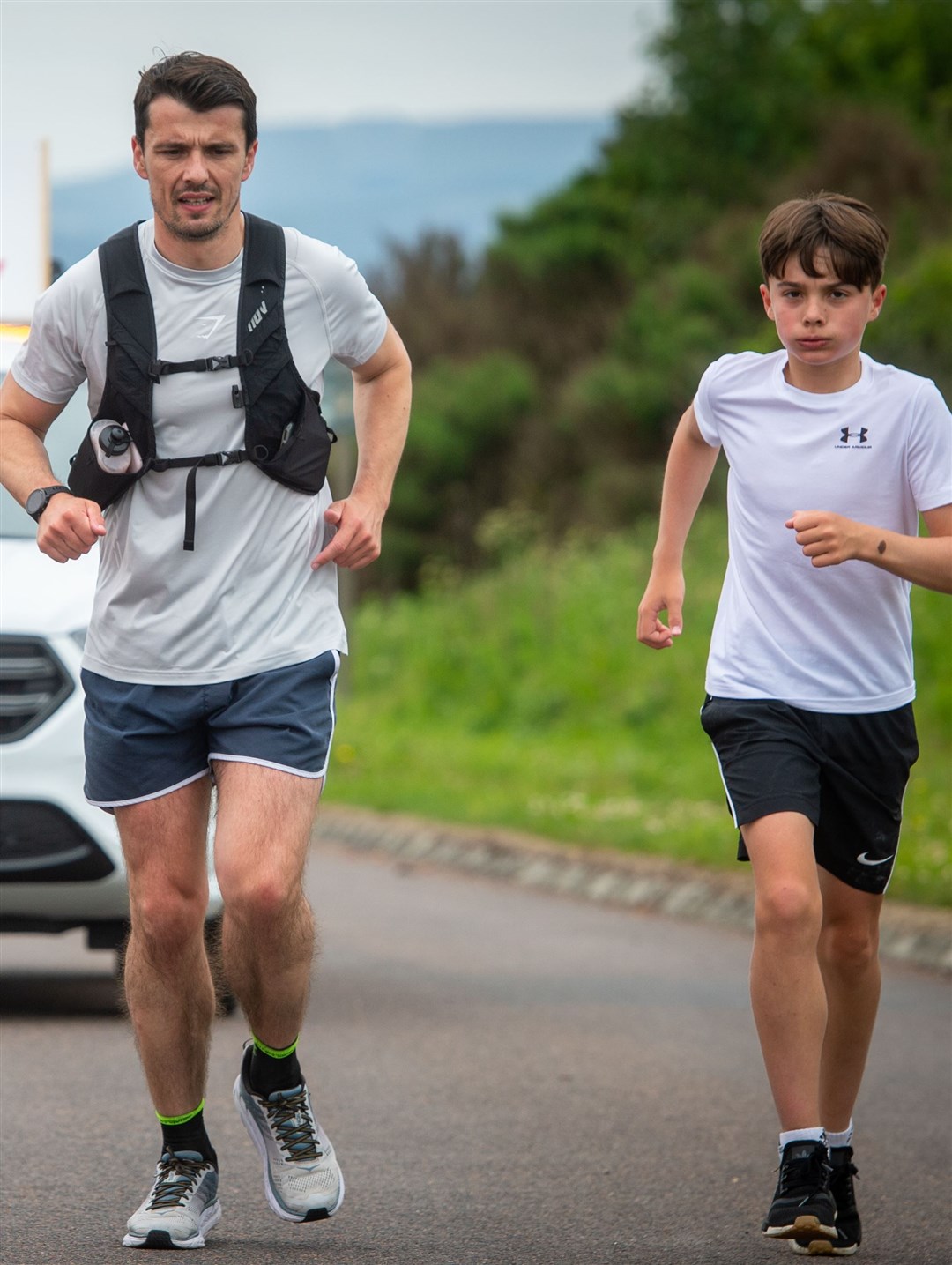 Mackay and son Dylan, who ran a marathon with him.