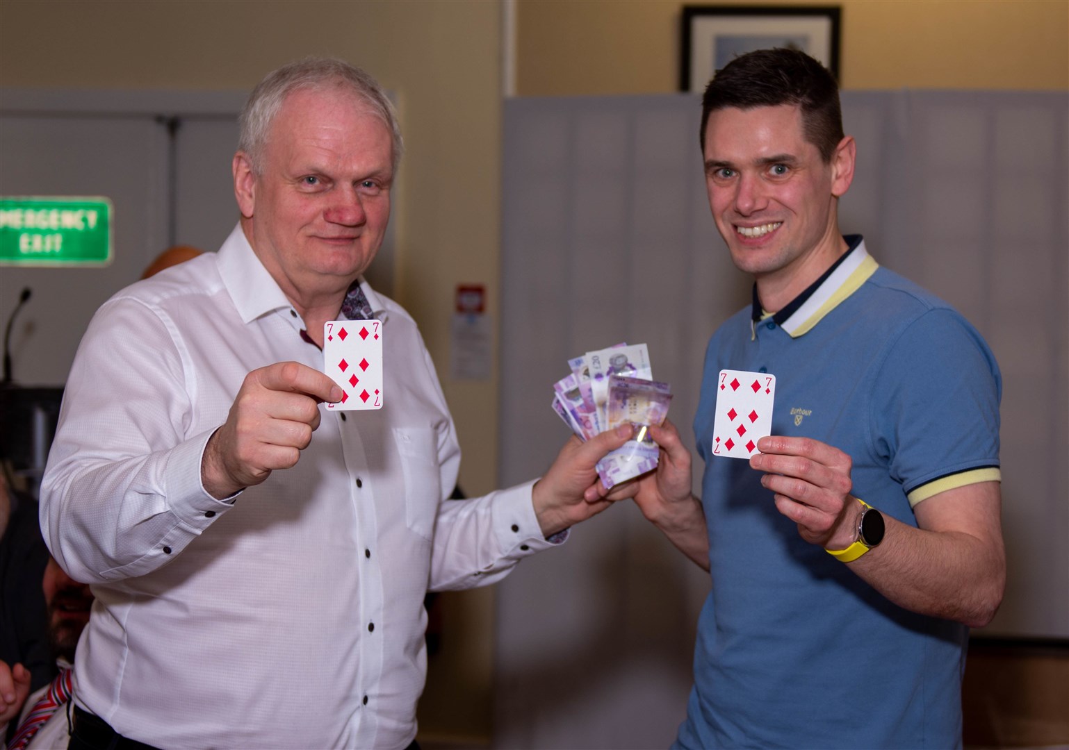 Winner of the Lucky Card cash prize, Lee Martin, along with guest speaker James Oliver. Photo: George Reid