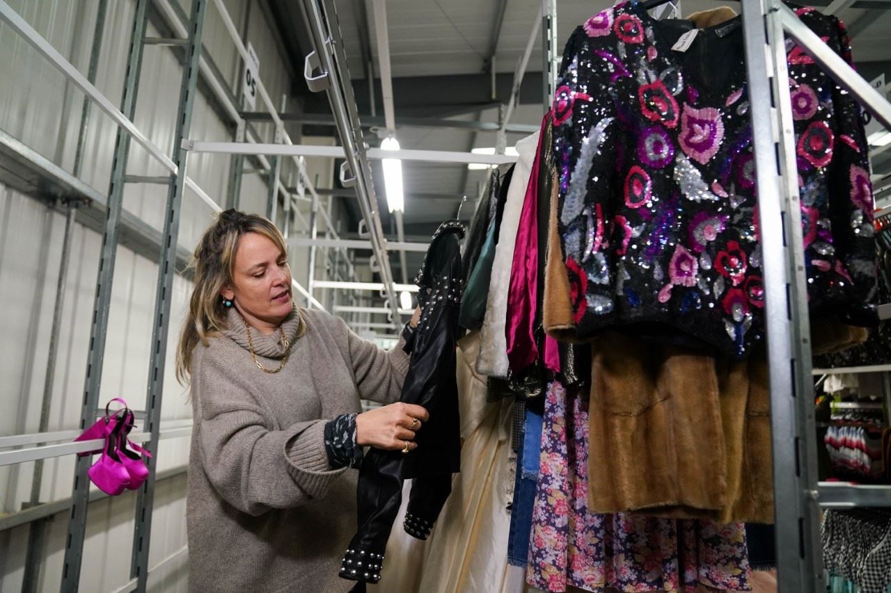 Bay Garnett selects some of the best items from the second-hand range of clothes (Jacob King/PA)