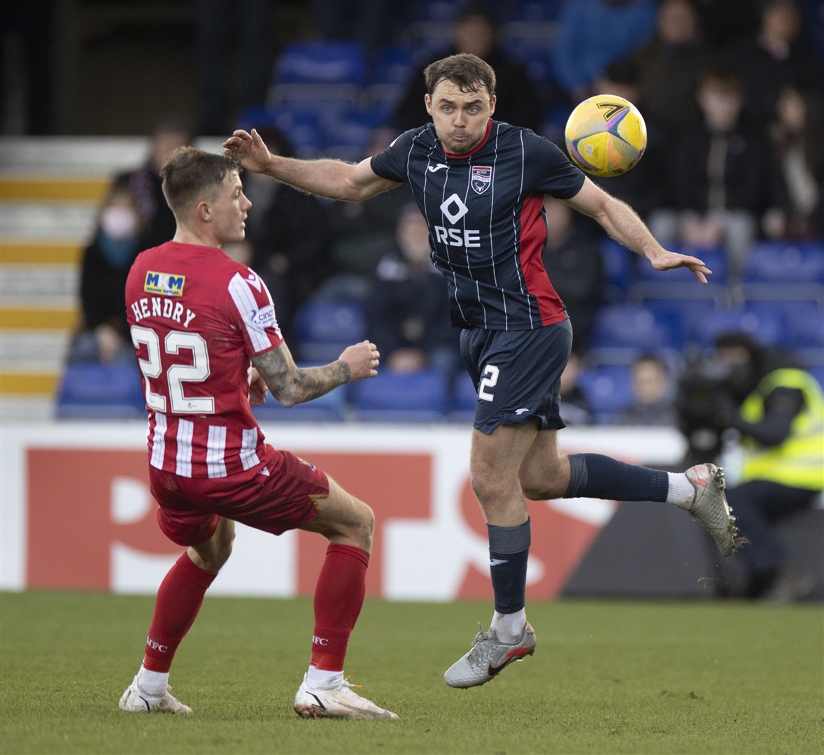 Ross County's Connor Randall clears from St.Johnstone's Callum Hendry.