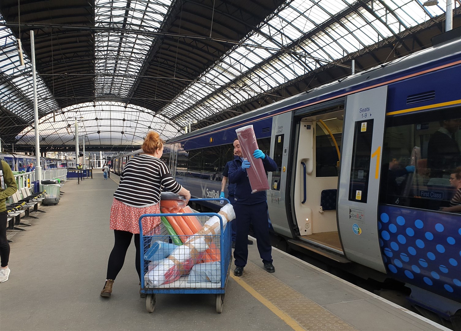 ScotRail staff at Glasgow Queen Street help load fabric on to 10.10am service to Inverness on Friday, April 24.