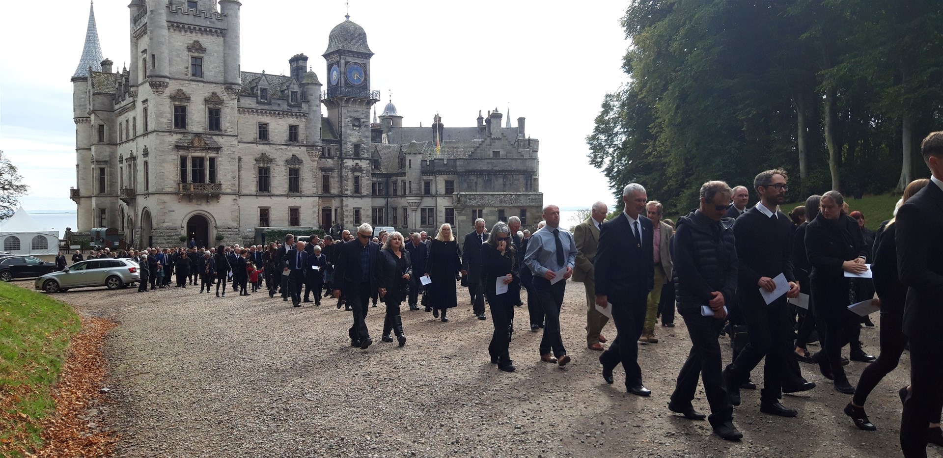 Mourners fell in behind the cortege and forming a long line, followed it to the family cemetery in the castle grounds.