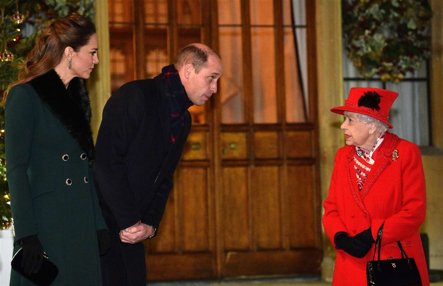 The Queen talks with the Duke and Duchess of Cambridge in the quadrangle at Windsor Castle (Glyn Kirk/PA)