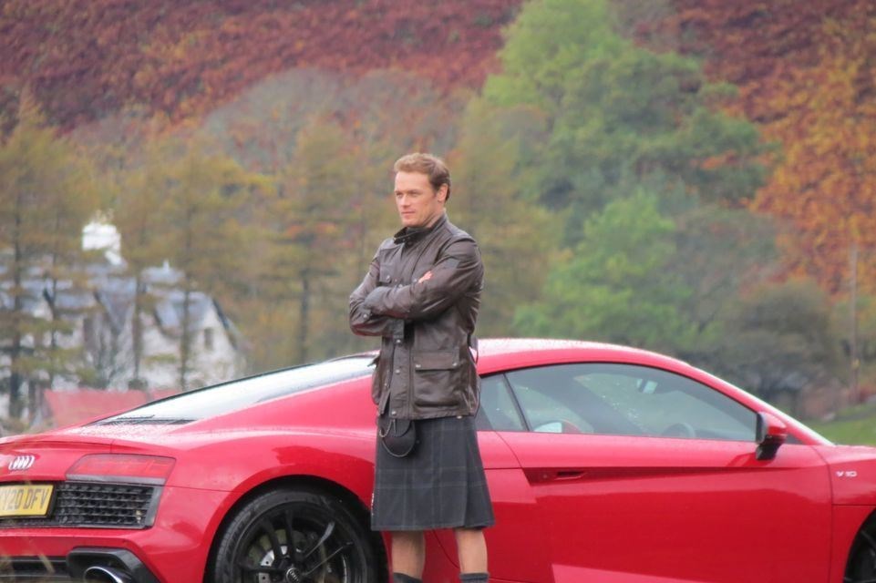 Something for everyone - a nice car, and Mr Heughan.