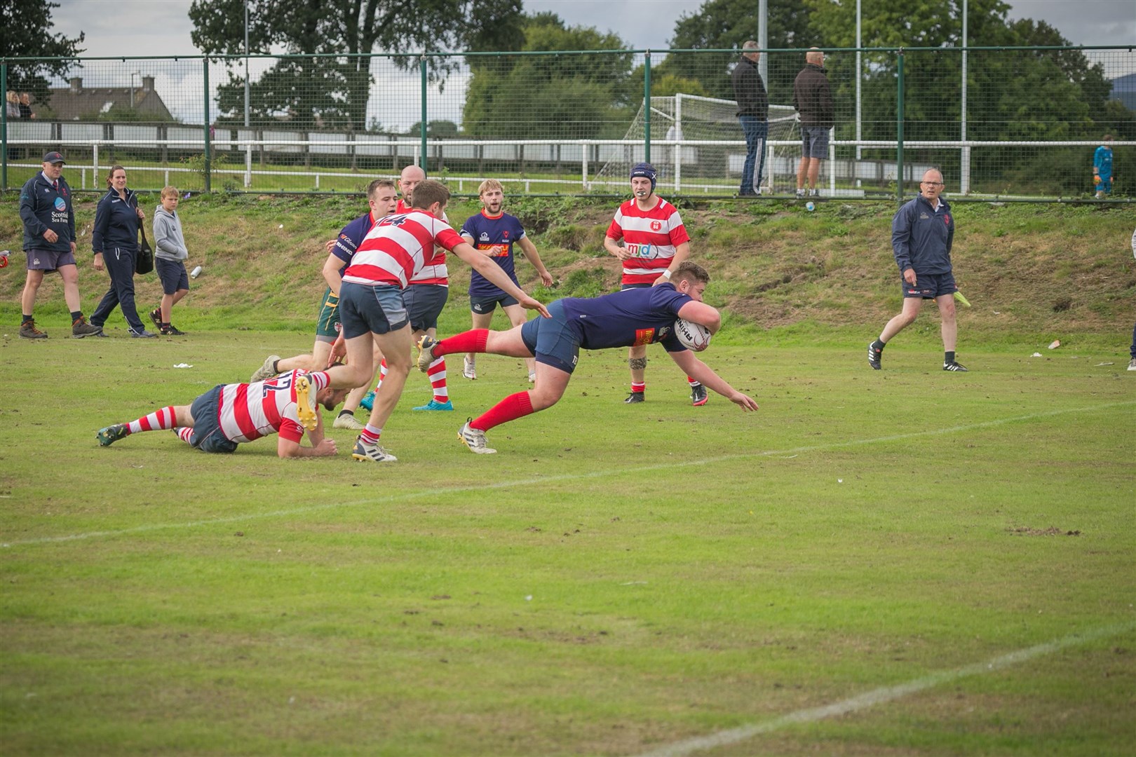 Ross Sutherland captain Tom Bannerman dives clear of the last line of Moray's defence last weekend. Picture: Peter Carson