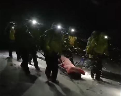 The climber is stretchered off the hill by the Cairngorm Mountain Rescue Team members after being unable to go any further due to exhaustion.