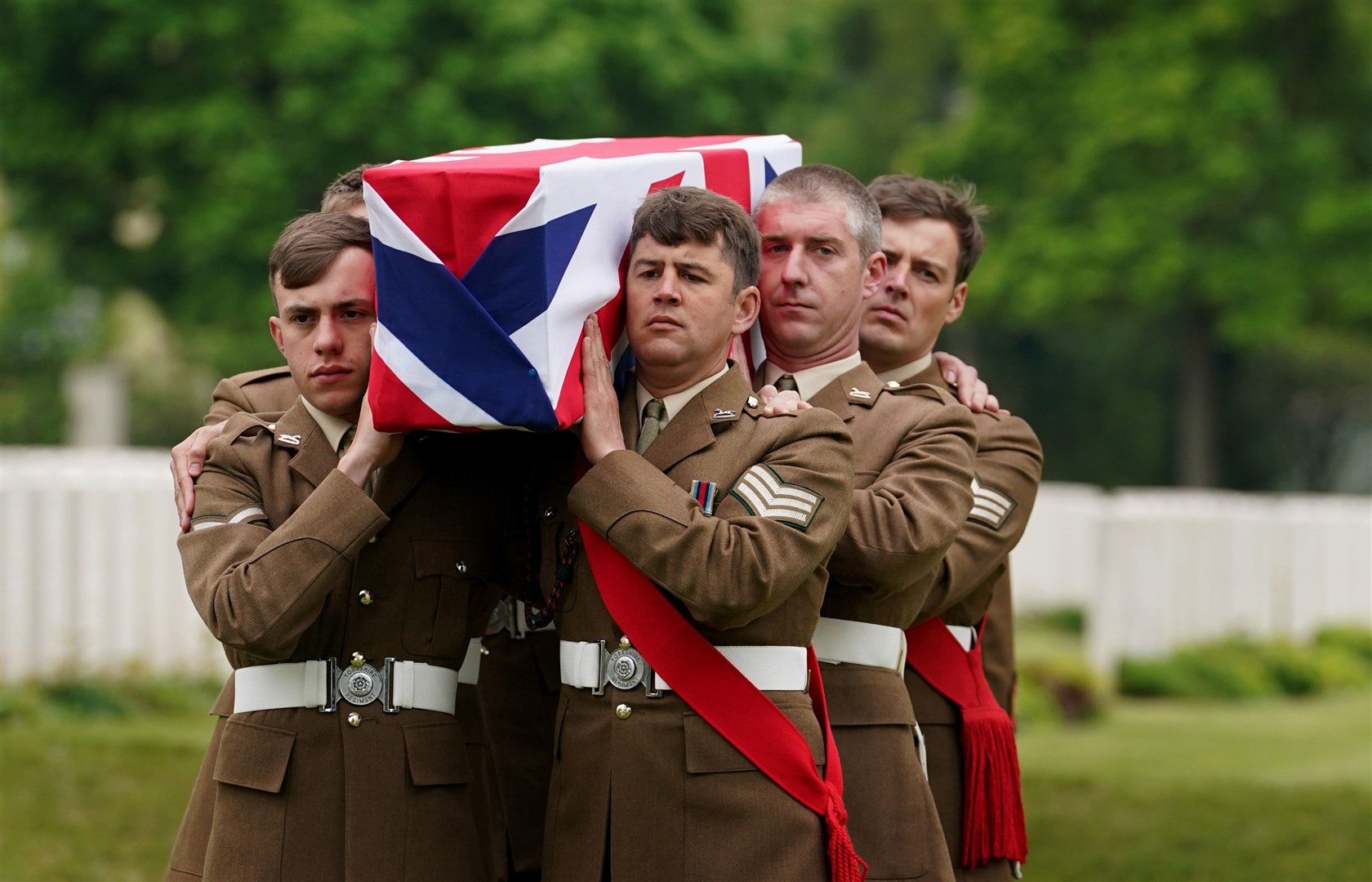 The coffin of the unknown soldier of the East Yorkshire Regiment is buried at Loos British Cemetery (Gareth Fuller/PA)