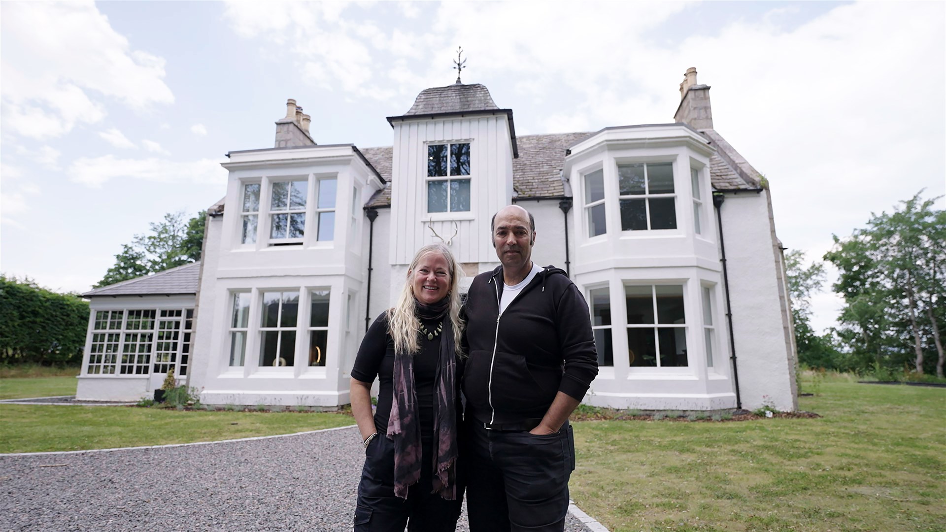 Dianne Dain and Salem Avan in front of the home which is in the running for Scotland's home of the year.