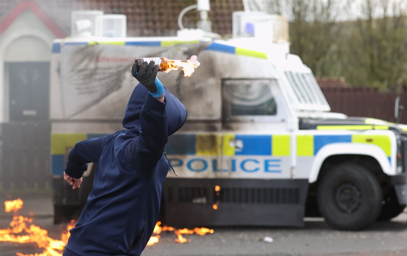 Youths throw petrol bombs at a PSNI vehicle ahead of a dissident Republican parade in the Creggan area of Londonderry on Easter Monday (Liam McBurney/PA)