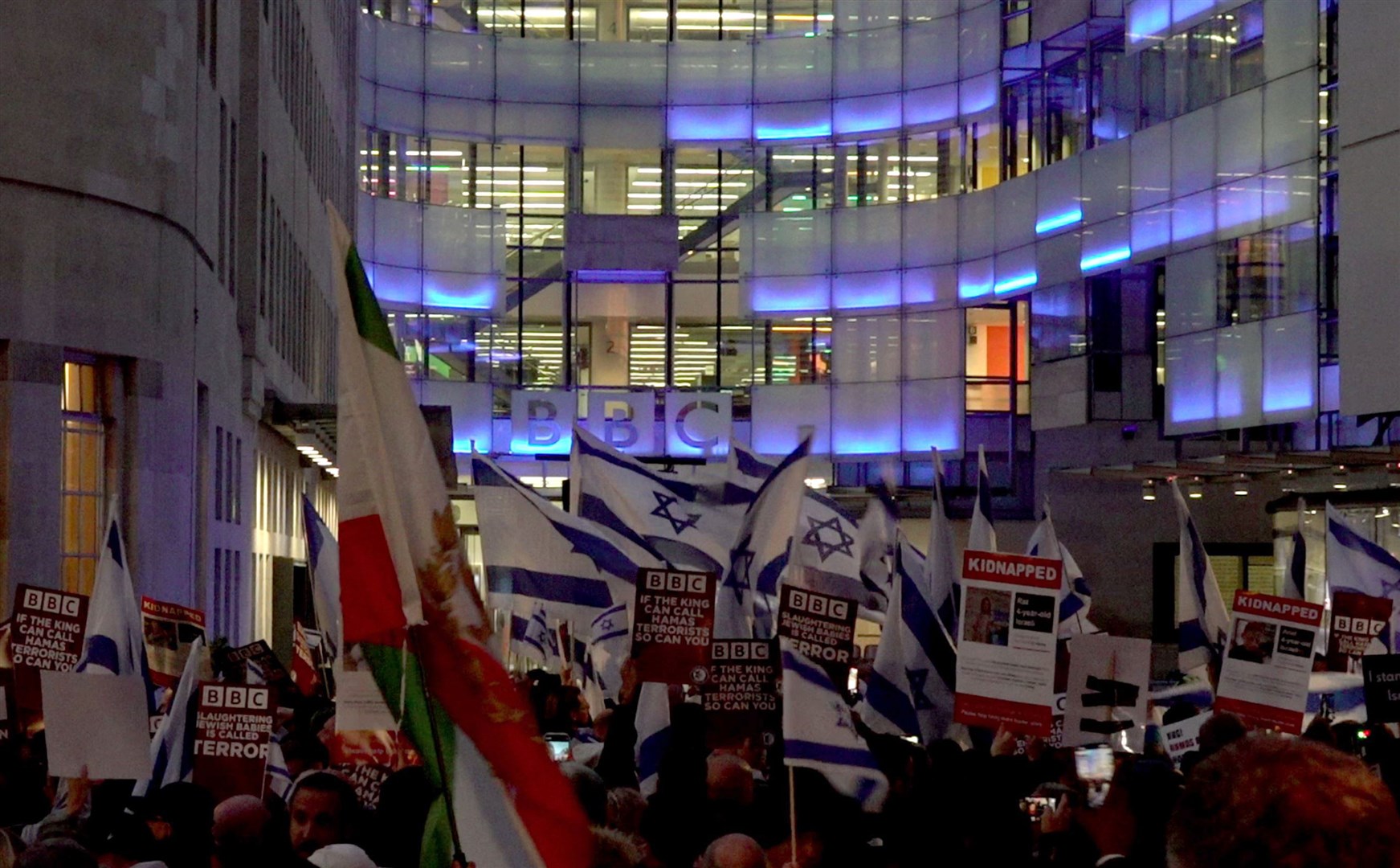 Protesters outside BBC Broadcasting House, London, calling for the BBC to change its stance on not labelling Hamas as terrorists (PA)