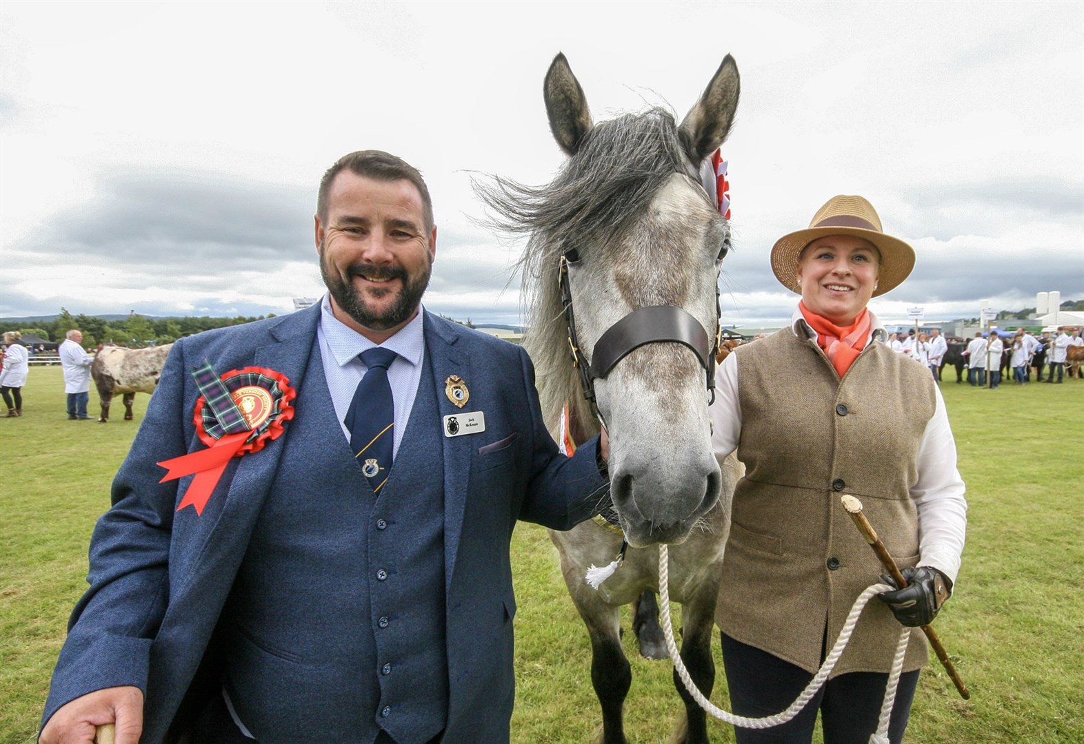 Black Isle Show president Jock McKenzie with this year's champion of champions, McGregor of Millfeld, a Highland Pony shown by Sara-Jane Forbes. Photo: Marc Hindley/Black Isle Show