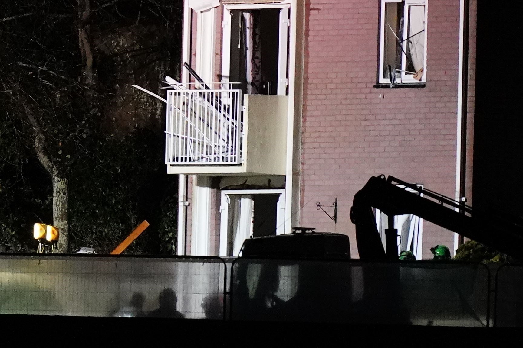 Emergency personnel at the scene of an explosion and fire at a block of flats in St Helier (Aaron Chown/PA)