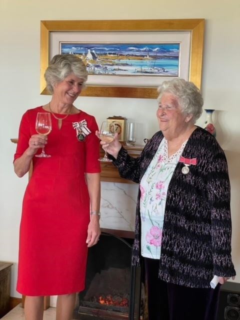 Kathleen Sim (right) after receiving her British Empire Medal from Lord Lieutenant Joanie Whiteford.