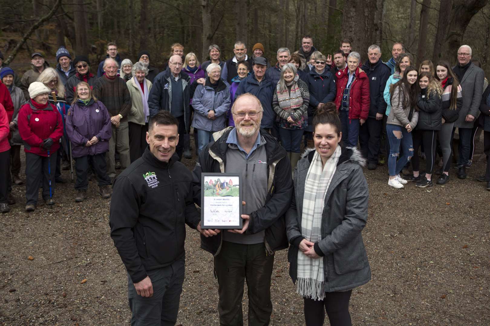Pictured with Evanton Community Woodland’s Dementia Friendly Environment recognition award are (l-r) Simon Harry, Evanton Woodland education officer, Douglas Wilson of Evanton Community Woodland and Kayleigh Lytham, Paths for All development officer.