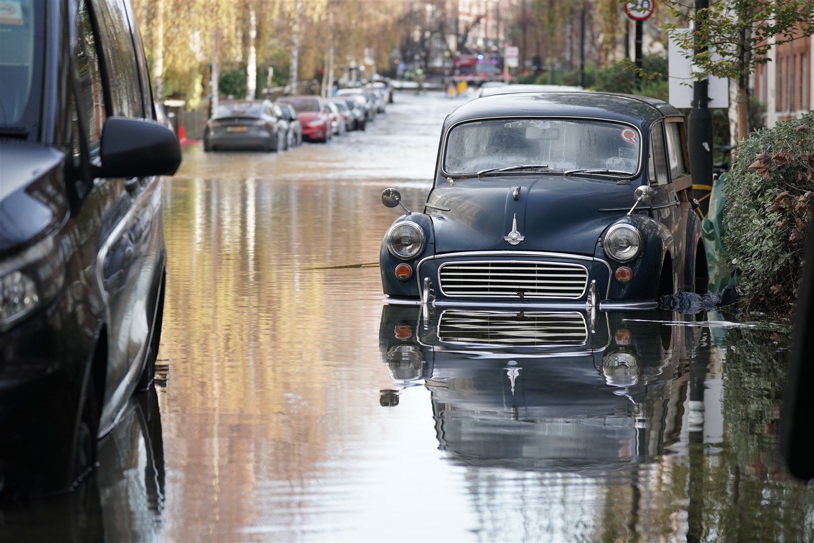 The flooding submerged many cars parked on the road (Yui Mok/PA)