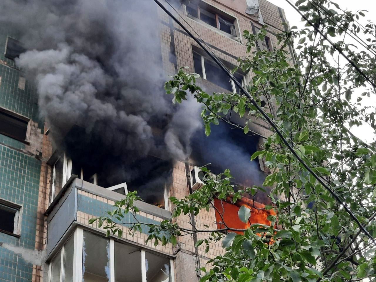 Smoke and flames rise from a block of flats