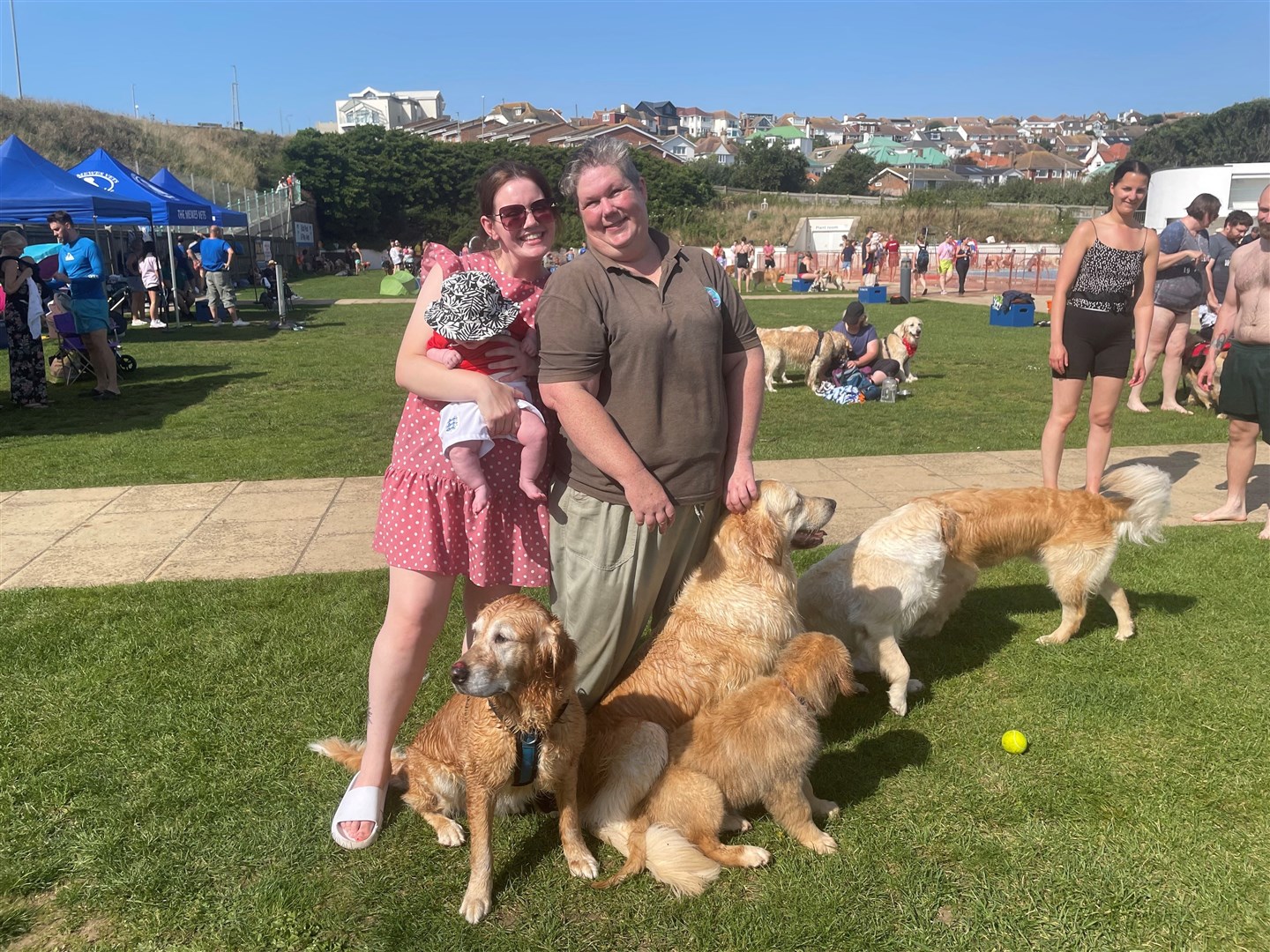 Kent and Sussex Golden Retriever club founders Millie Goad and Donna Sherlock brought their group of golden retrievers (Anahita Hossein-Pour/PA)