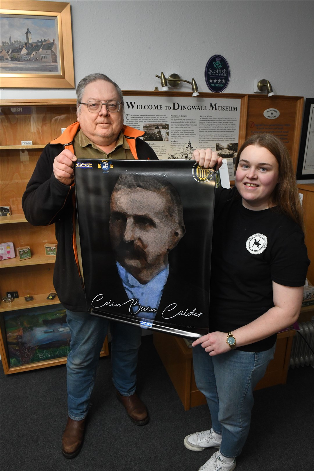 Jonathan McColl, vice-chair of Dingwall Museum Trust with Lindsay Hamilton, owner of of Glasgow Football Tour as she presents a very special gift from Argentina. Picture: James Mackenzie.