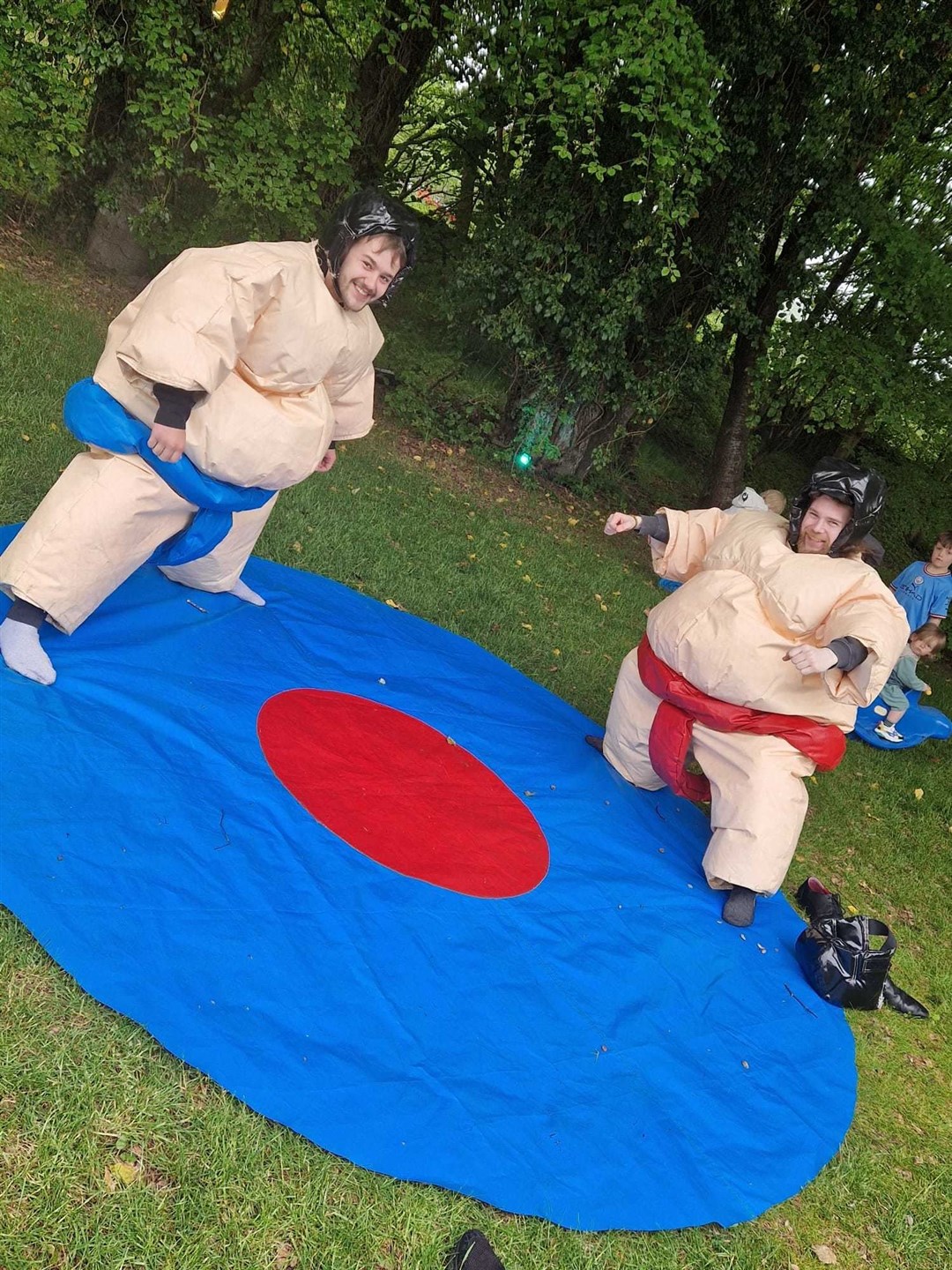 Conon Hotel first anniversary fun day: bar men Sandy Ironside and Logan McGee try the sumo suits