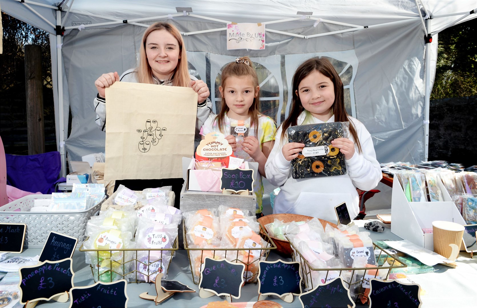 Isla Matheson (13), Freya Maclean (8) and Amelia Maclean (8) with the products they created at the Made by Us stall. Picture: James Mackenzie