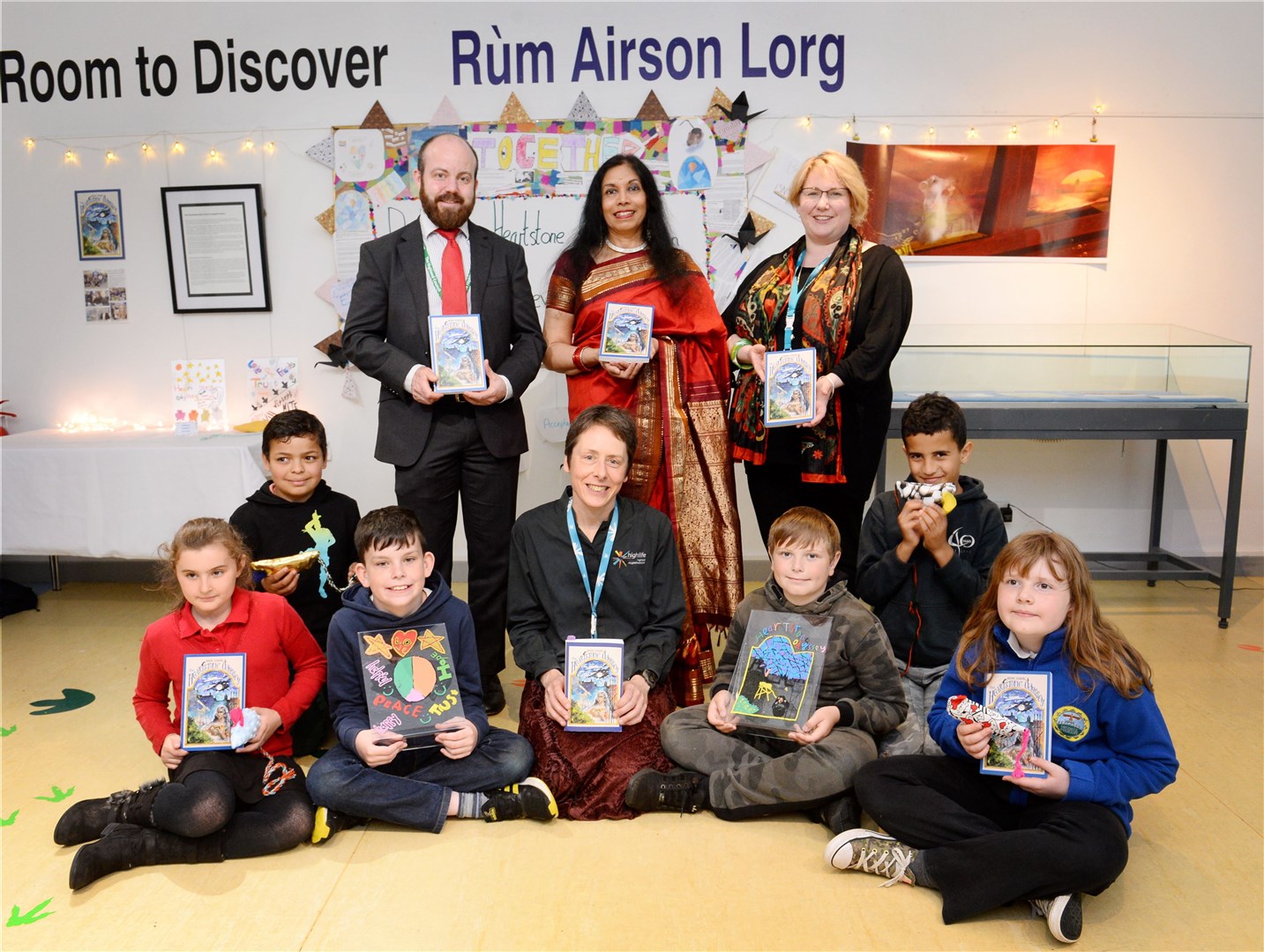 An exhibition of work produced by the first Heartstone Story Circle in the Highlands saw participants from Ross-shire showcase their efforts. Ellie Mackintosh, Fadi Ali, Mack MacKay, library assistant Joolz Christie, Kyle Linden, Oussam Al Hasan, Ella Howie (front) Nicholas Green, English teacher at Dingwall Academy,Sitakumari, director of Heartstone and Elizabeth Parker, senior network librarian. Picture: Gary Anthony. Image No.044188