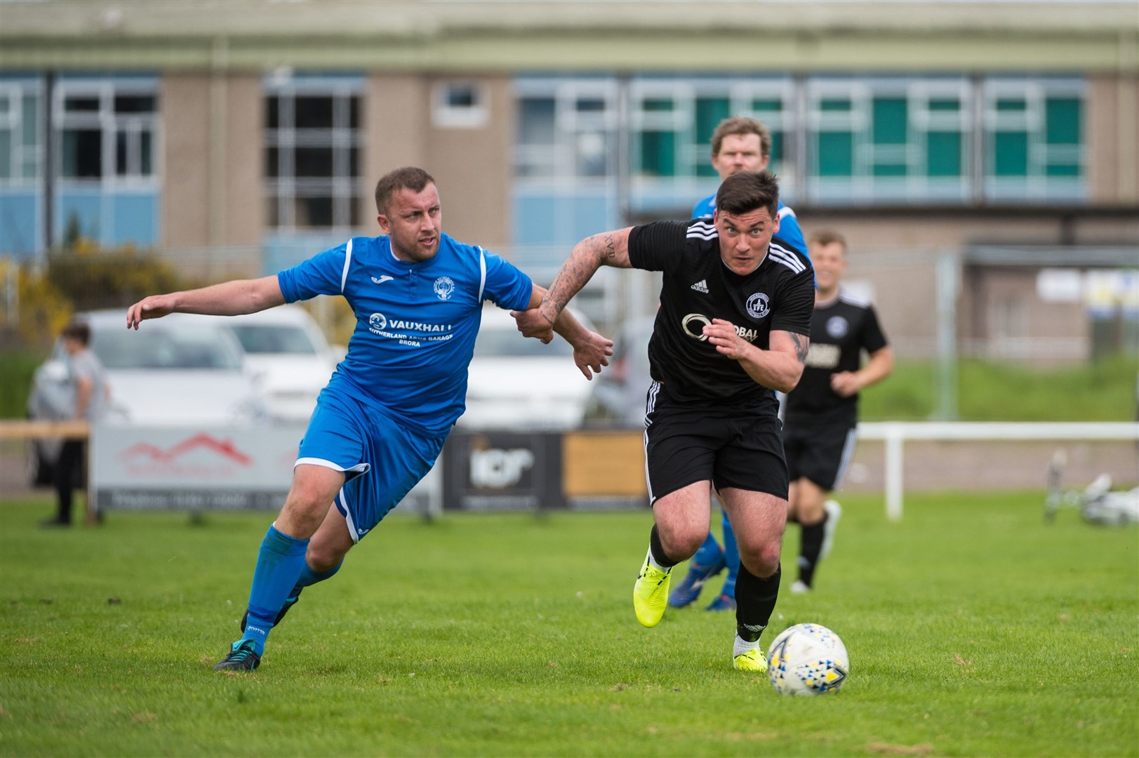 North Caledonian League 1..Invergordon 0 v 0 Golspie, Recreation Park, Invergordon..Invergordon's Stuart Leslie surges forward chased by Golspie's Blair Duncan..Picture: Callum Mackay..