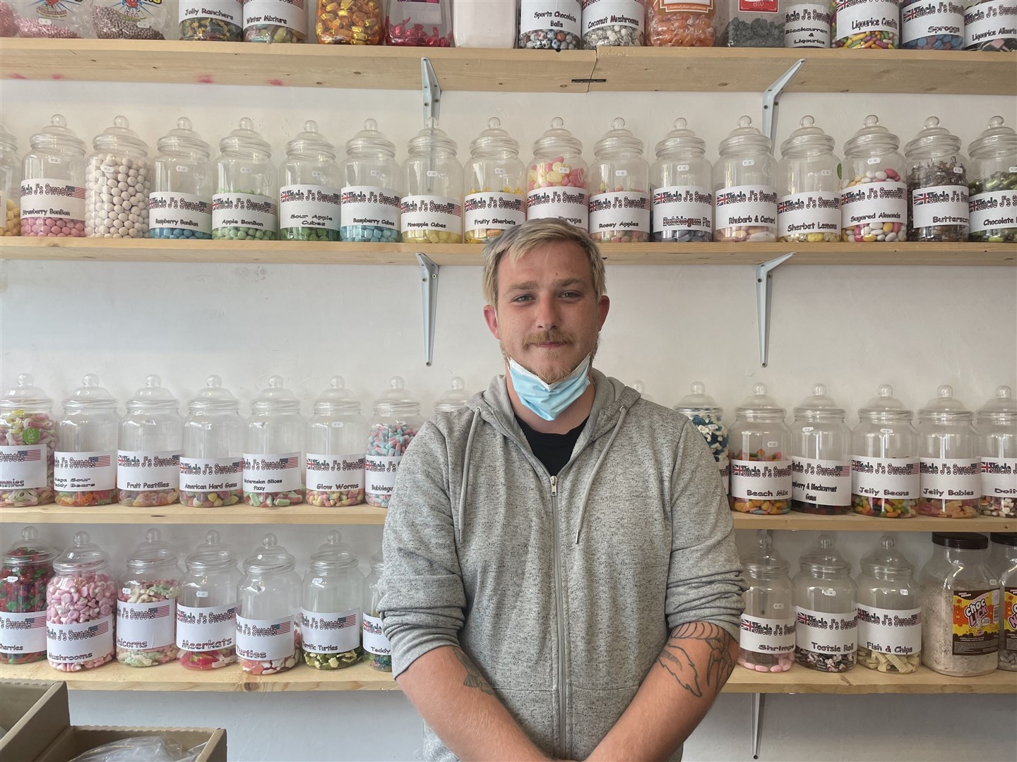 Clinton Matthews, owner of J’s Sweets, inside his shop in St Ives (Isobel Frodsham/PA)