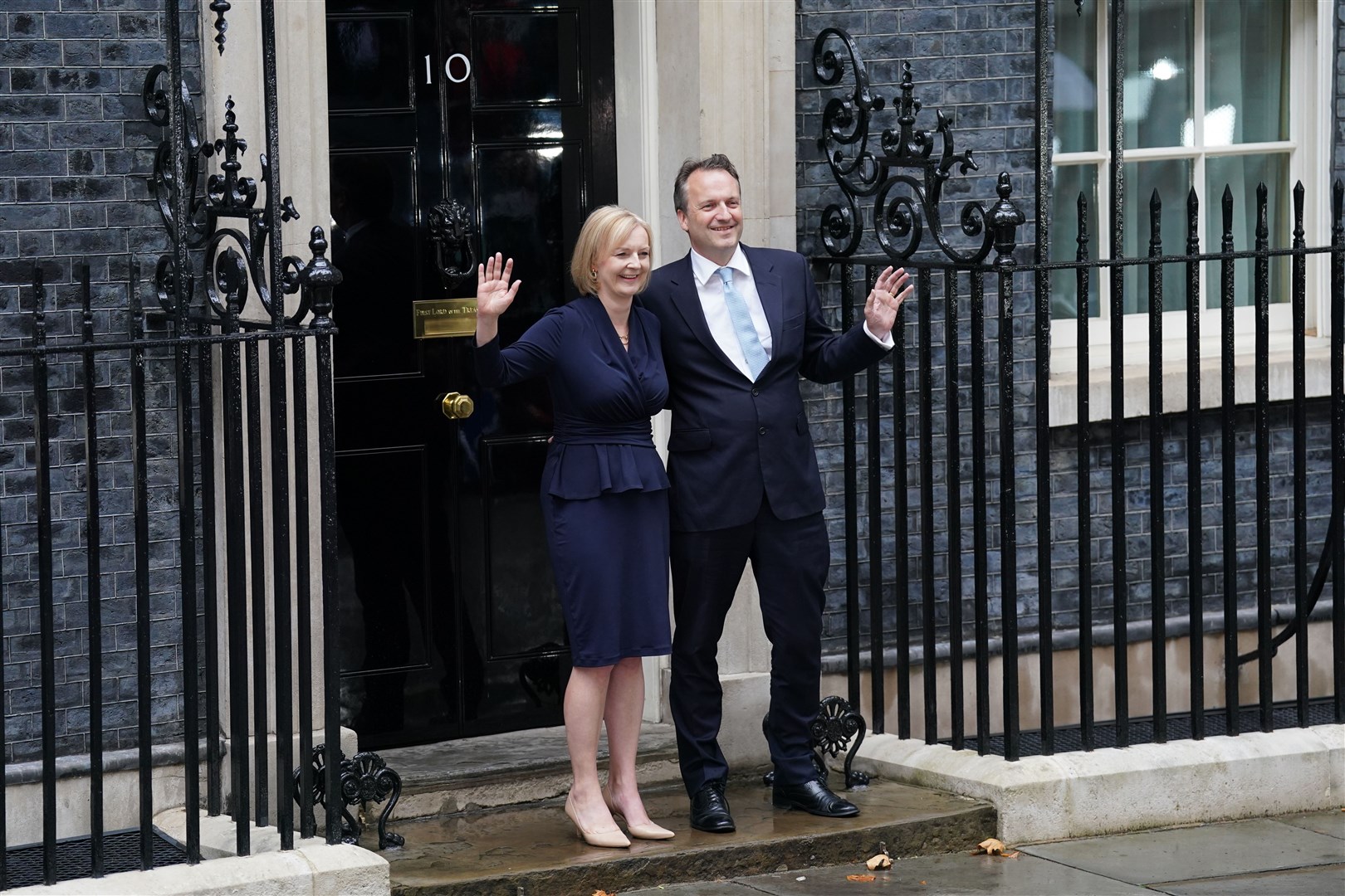 New Prime Minister Liz Truss with her husband Hugh O’Leary after making a speech outside 10 Downing Street (Kirsty O’Connor/PA)