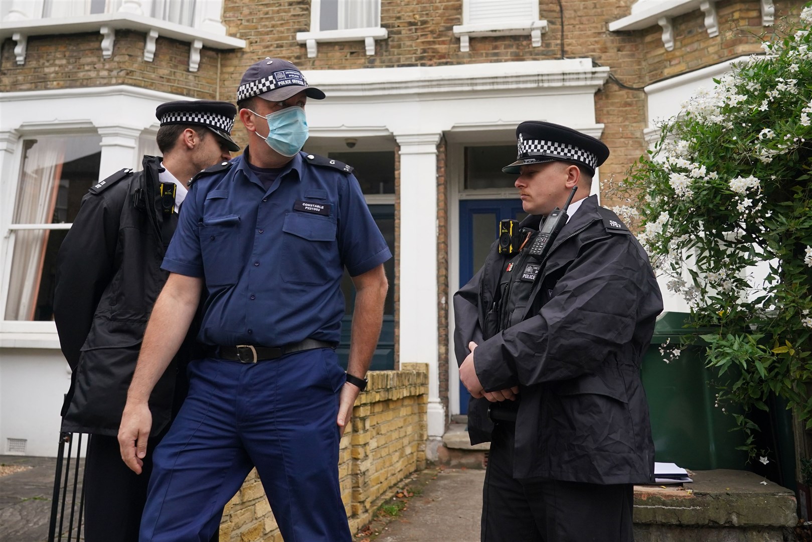 Police search a house in north London (Dominic Lipinski/PA)