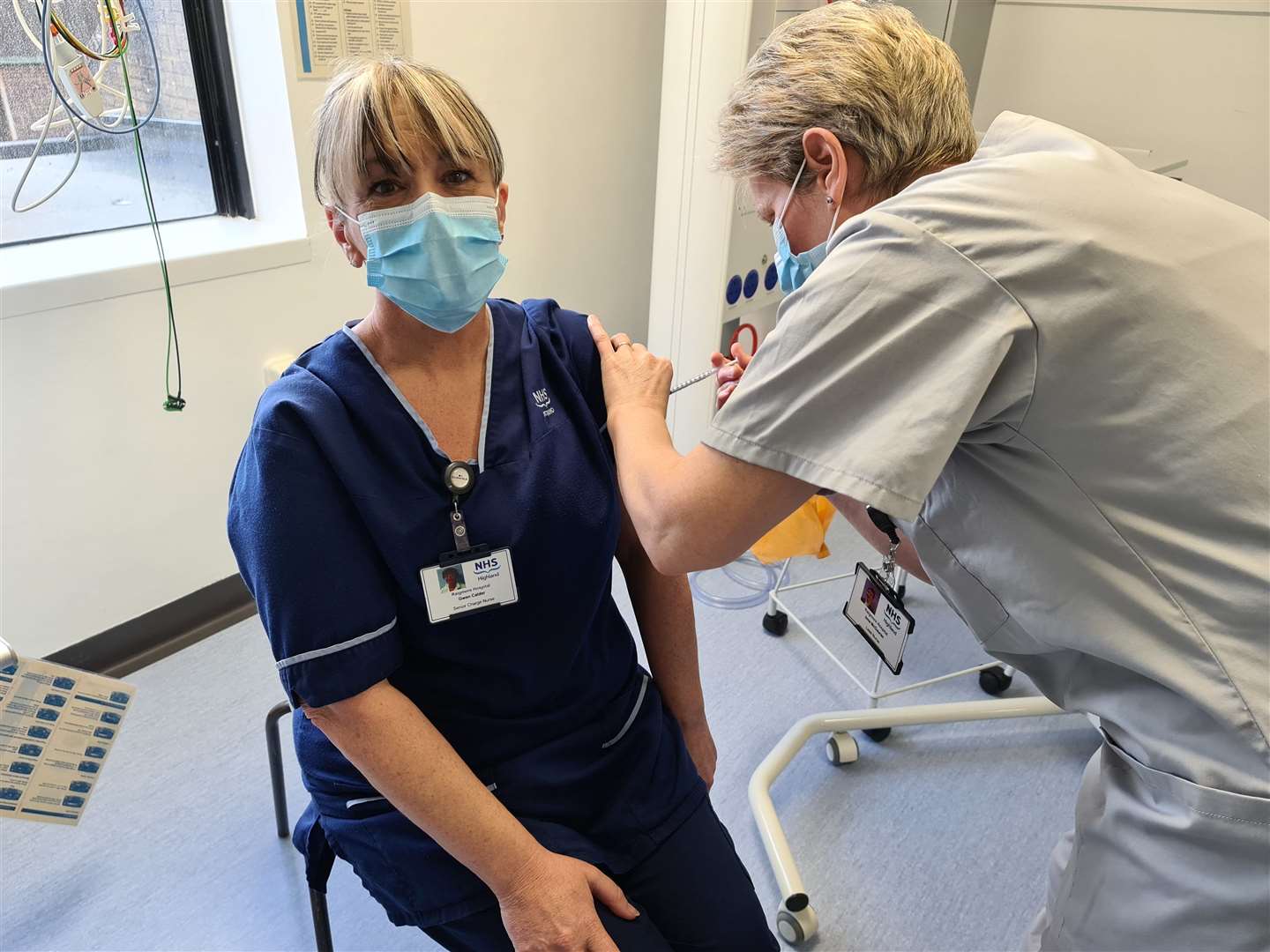 Senior charge nurse Gwen Calder, from critical care at Raigmore Hospital, receiving the vaccination.