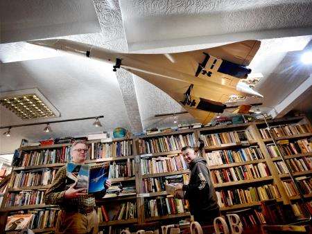 Bill Anderson, proprietor of High Flight bookshop in Dingwall, (left) and customer Jeremy Simpkins admire the model Concorde. Picture: Gair Fraser.