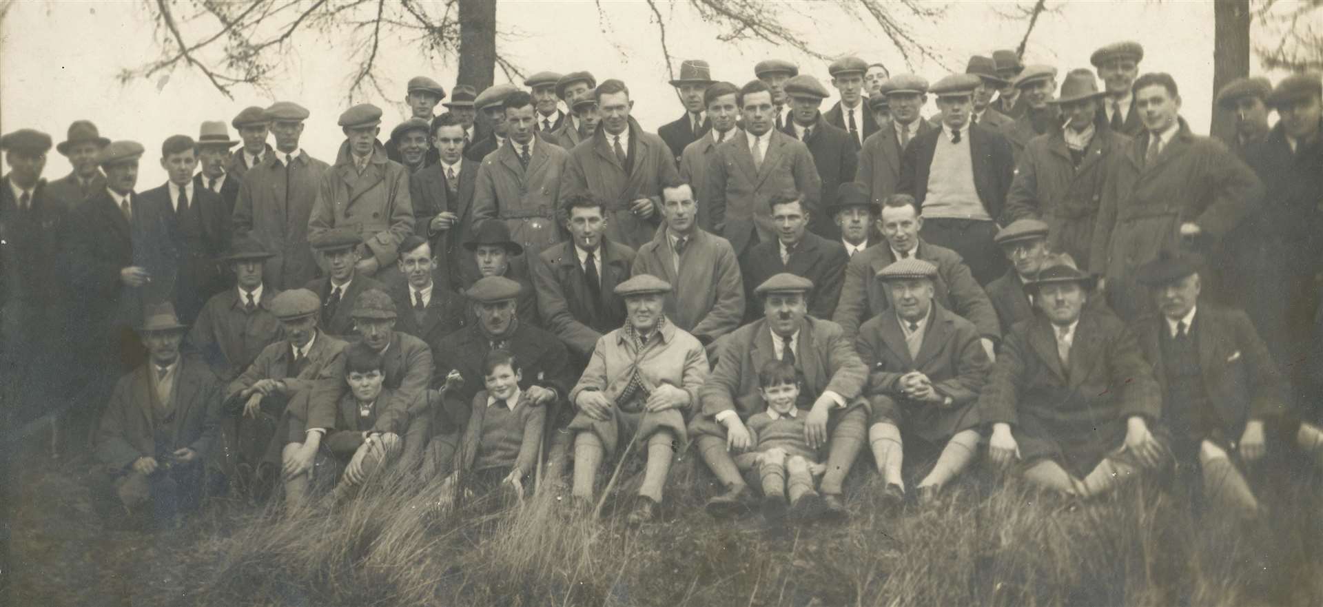 An agricultural ceilidh of three Junior Farmers Associations (Aird, Inverness and Marybank) at Garguston on January 30, 1932 where a demonstration was given on Clydesdale/Shire horses by John MacKenzie, Balnain and Shorthorn cattle by K J MacGillivray, Kirkton..Front row: “Culduthel”, J MacKenzie, Balnain, Capt J Cameron, Balnakyle, K J MacGillivray, Kirkton, J Cumming, Allanfearn, R S MacWilliam, Garguston, J Black, North of Scotland College of Agriculture (Inverness Area), W A Longmore, North of Scotland College of Agriculture (Ross-shire Area), A W Hill, late of Lemlair, with the students in the background..