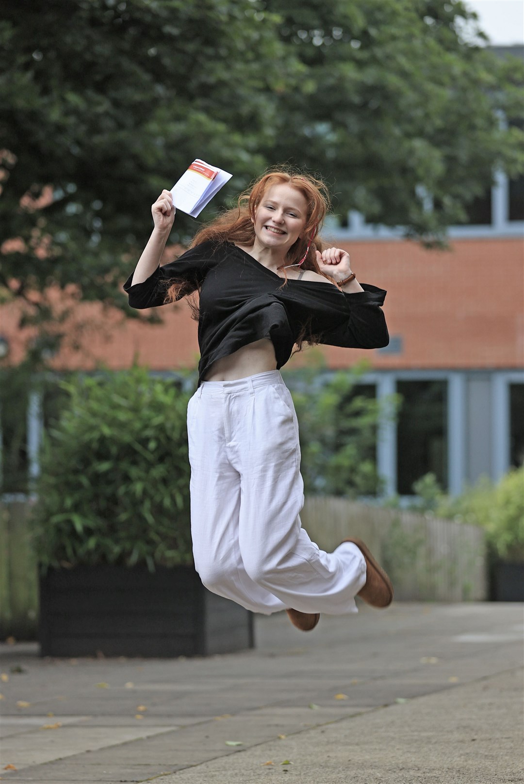 Caoimhe McClure receives her A-level results at Lagan College, Belfast (Liam McBurney/PA)