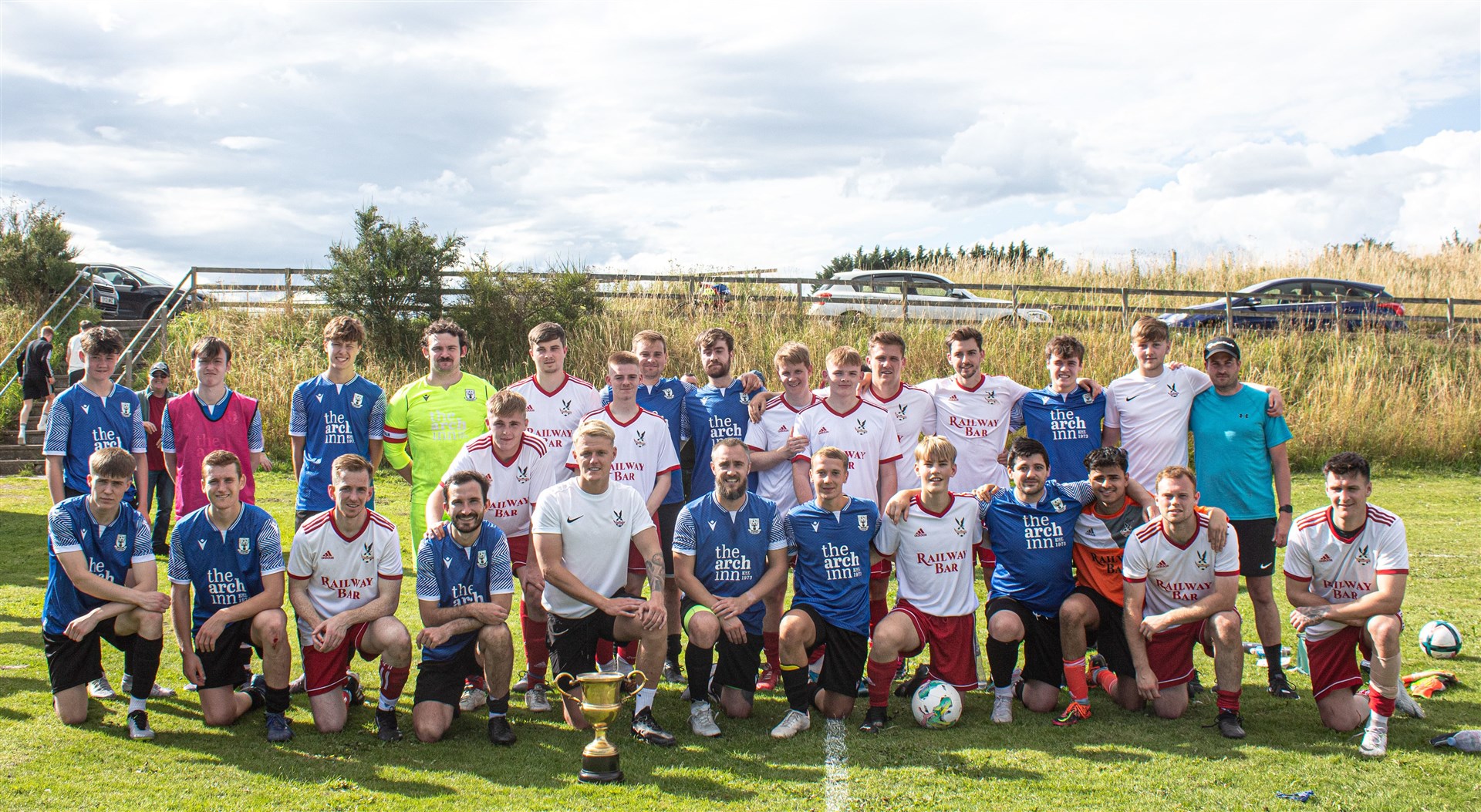 Players from Tain Thistle and Lochbroom line up after contesting the Kenny Raigie trophy. Photo: Niall Harkiss