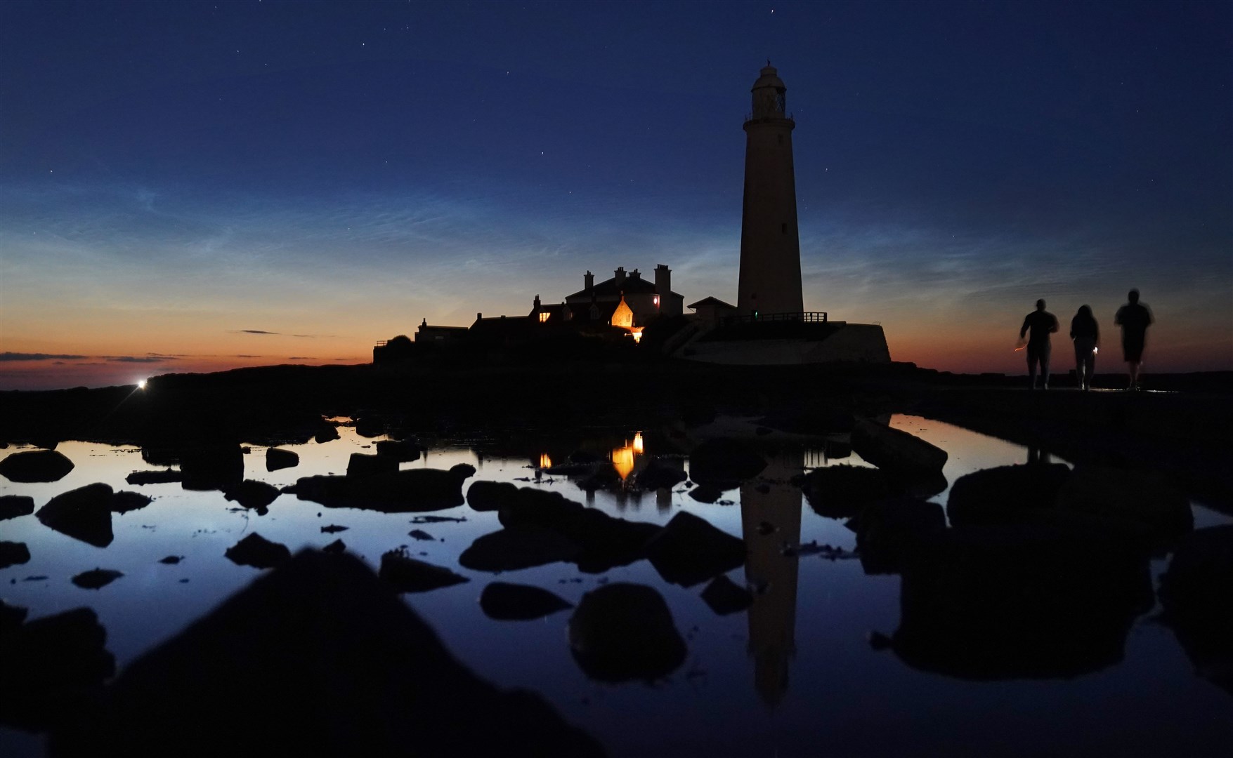 Beautiful light over St Mary’s Lighthouse near Whitley Bay as night descends (Owen Humphreys/PA)