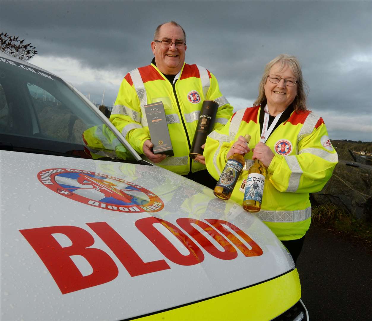 Highland and Islands Blood Bikes.Fundraisers Geoff Matthews and Julie Bradbury having whisky auction. Picture Gary Anthony.