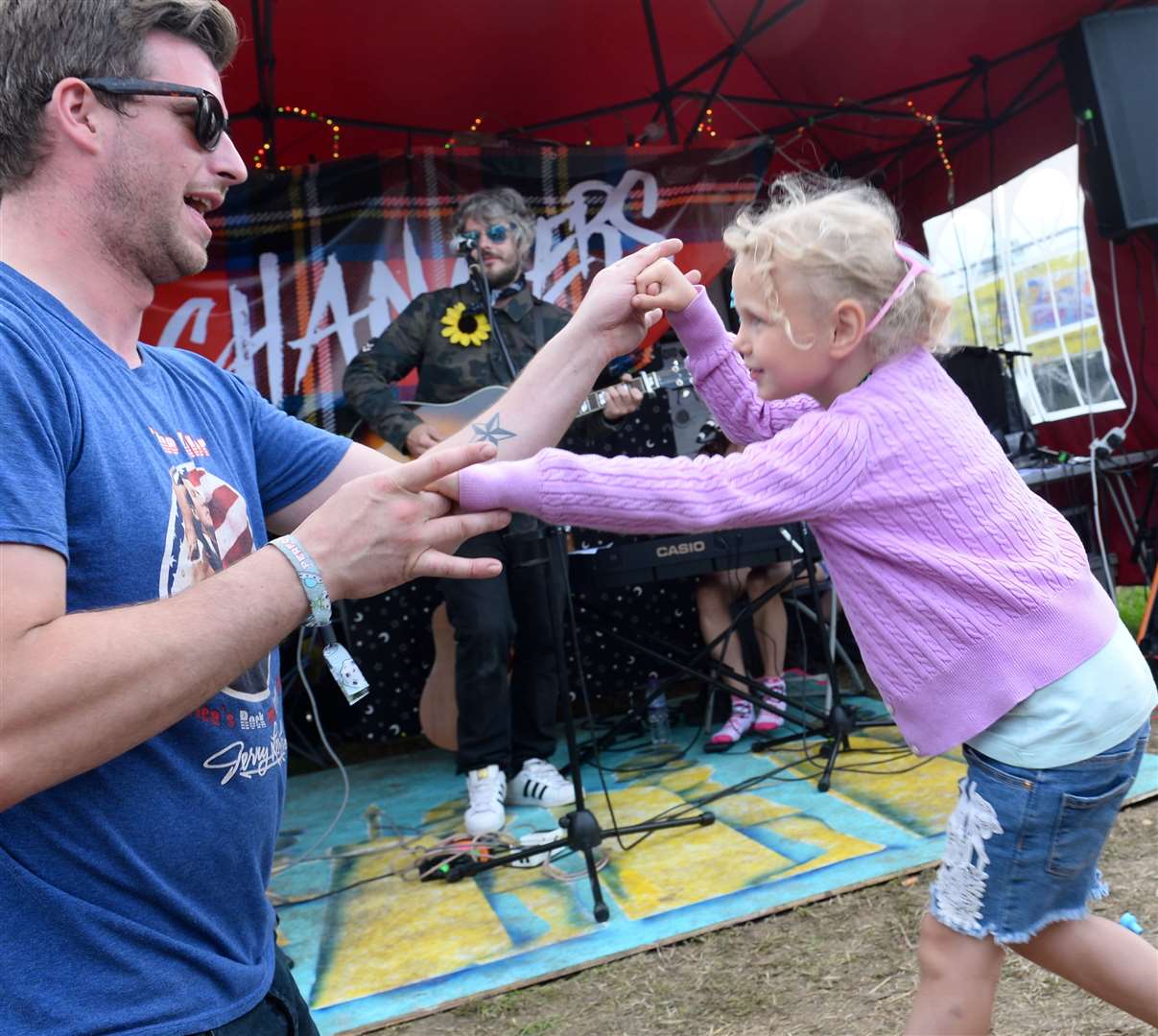 Belladrum 2019. Isla Bolt dances as dad Jake Bolt sings in Inverness band Chancers. Picture: Gary Anthony. Image No.044555.