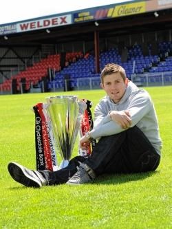 Ross County captain Richard Brittain with the SPL trophy at the launch of the SPL fixture list.
