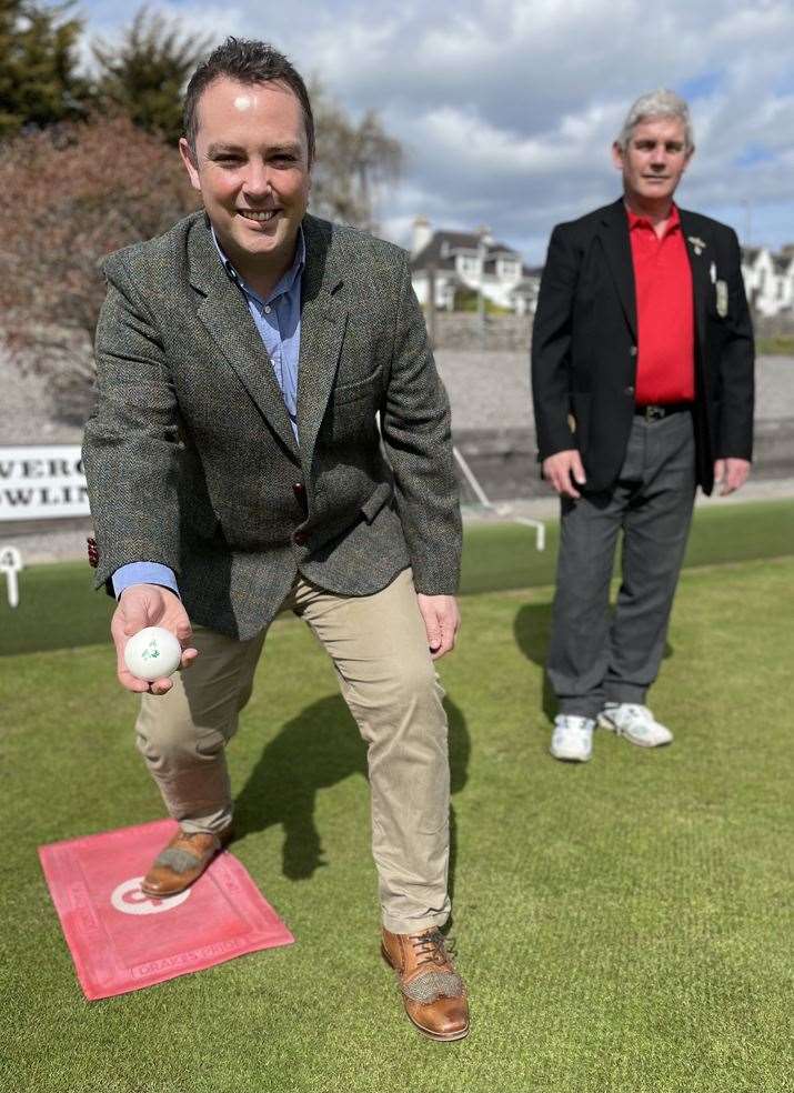 Shane Healy, Distillery Manager, Invergordon Distillery prepares to launch the first jack of the 2022 outdoor turf season overlooked by club chairman Charlie Gallacher.