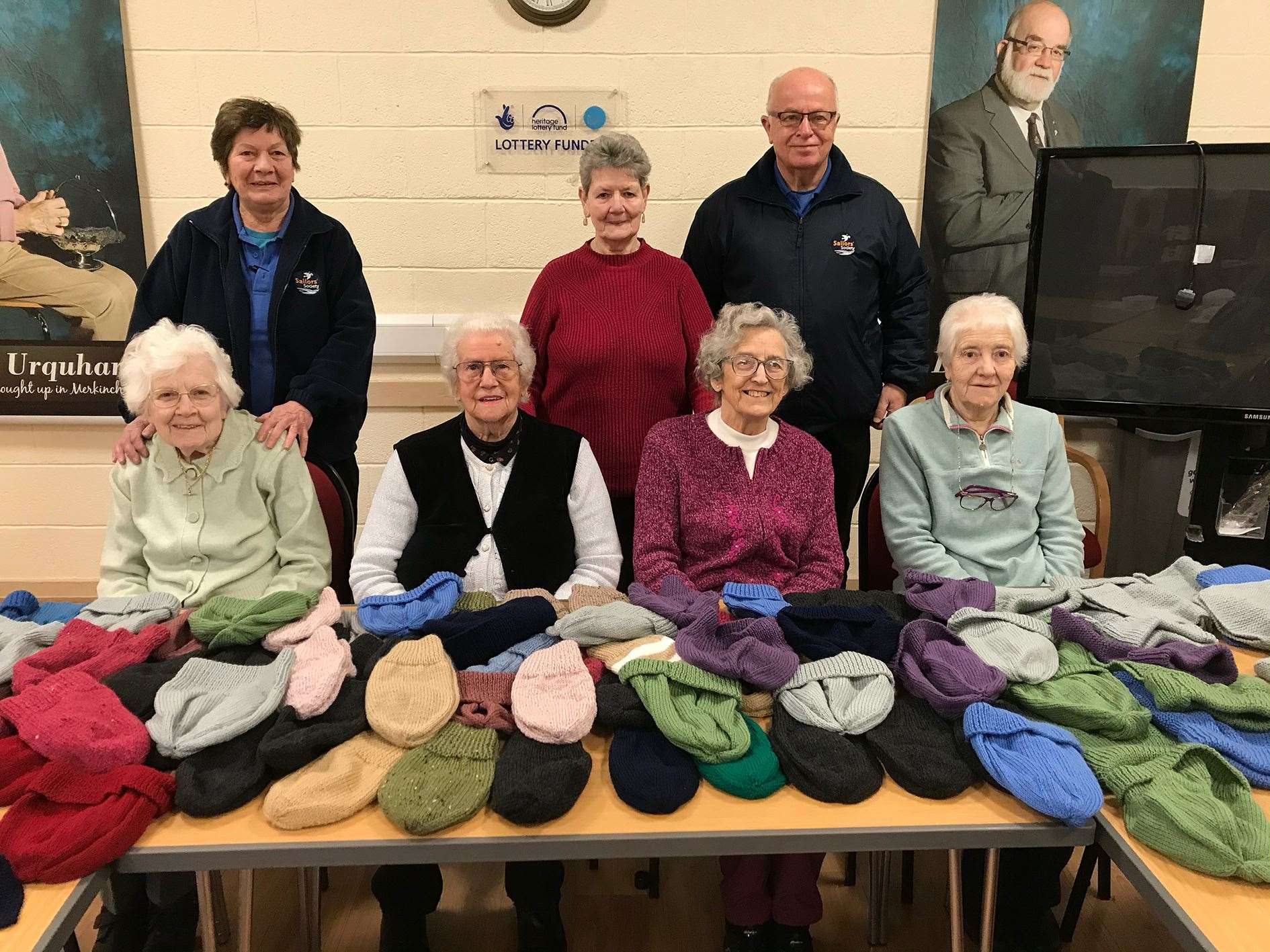 Drew and Elizabeth Anderson, of the Sailors Society, with Kay MacKenzie (centre) and other memers of the knitting group at Merkinch Community Centre.
